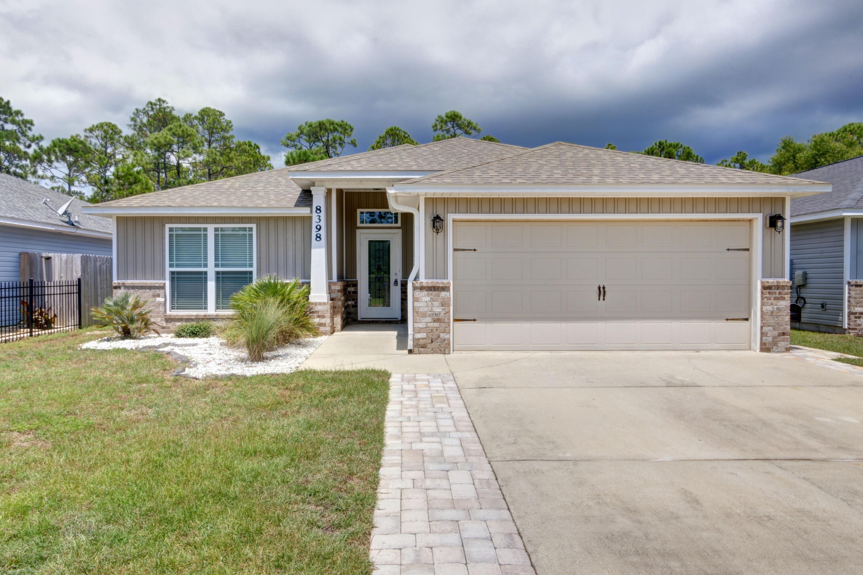 Welcome home to this beautiful and affordable perfectly located East Navarre craftsman home in the popular neighborhood of Duncan Ridge! Featuring 3 bedroom, 2 baths, and an office space in 1555sqft, this is the move in ready beauty you've been waiting for! Enjoy a neighborhood setting with a short commute to Hurlburt and conveniently located walking distance to Navarre High School as well as the YMCA, NYSA, dog parks, and sports facilities. Pull up the drive and you'll appreciate the pavers extending the driveway and you'll love the location just off the cul-de-sac on a dead end street! This fantastic split floor plan showcases two nice sized bedrooms and a shared bathroom at the front of the house, and through French doors you'll find the master bedroom on the other side. Enjoy an open floor plan and picture yourself cooking in the well appointed kitchen with granite countertops, and stainless appliances. Relax in the spacious living room or get some work done in the enclosed office space overlooking the backyard and covered patio. The owner's suite has plenty of room for your king sized bedroom suite and you'll love the dual vanities, massive walk in closet, stand up shower, and separate soaking tub. Don't delay in making an appointment to view this well maintained home and prepare to fall in love!
