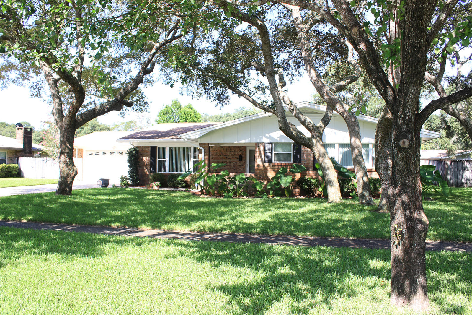 WANTED - NEW FAMILY! This charming 4 bedroom 2 bath home is looking for a new family to build new memories. Located in the highly desired Kenwood neighborhood centrally located to either Eglin AFB or Hurlburt Field....not to mention Kenwood Elementary is just a couple of blocks away along with a children's playground, golf course, and tennis courts. This all brick home is 1910 SF with a 2 car garage with a beautiful landscaping in both the front and back along with a large screened in porch to relax in. As you enter the home the formal living room is on the left or your may continue straight into the combination family/dining/kitchen area complete with a built in bookcase as well as a built in desk. Kitchen features a gas cooktop, stainless oven and refrigerator, and breakfast bar. This area also has pocket doors to access or close off the formal living room. This area is a fabulous space for family to gather and share the days events.    From this area are sliding glass doors that open to the screened in porch...large enough for a hot tub.  The back yard is fully fenced with a privacy fence and gates on both sides.  The large guest bath offers a skylight to enjoy the natural light and the tub has recently been resurfaced.  The Master Bath has recently been resurfaced and offers a nice size shower with a built in seat.  Other features include updated double paned impact resistant windows, alarm system, sprinkler system with timer, large covered front porch, gas heat and hot water heater, storage building.  Kenwood offers sidewalks throughout which is awesome for those that like to walk, jog, or stroll with the family.  Seller has a transferable Home Warranty.  Make your appointment today!
