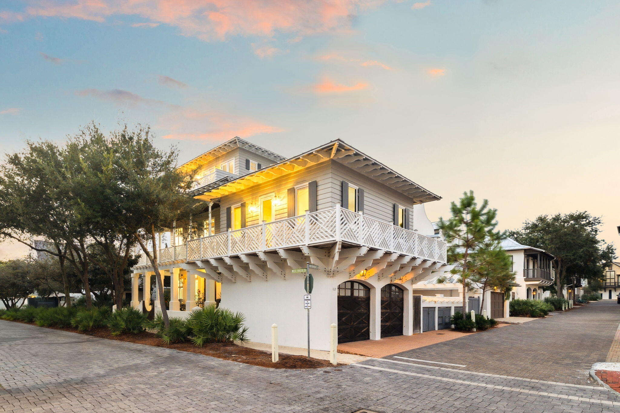 Welcome to 403 W Water Street, a rare opportunity to own one of Rosemary Beach's most remarkable residences. Located on the south side of 30A, four homes from the Gulf with Gulf views, just steps from the Town Center and Western Green, this home enjoys a premier location on a prominent corner lot along the iconic boardwalk to the H Beach Walkover. With 5 bedrooms, 6 baths and 4,592 square feet and wonderful storage, it blends timeless architecture with modern luxury.
The first floor features a living area, laundry room and three spacious bedrooms with king beds, each with private en-suite baths, providing a restful retreat for guests. The second floor is dedicated entirely to living, dining, and kitchen spaces, creating an open and light-filled setting for gathering and entertaining. A gas fireplace anchors the main living area, adding warmth and character to the expansive open floor plan. Upstairs, the entire third floor serves as the master suite. This private sanctuary is complete with a balcony and living area with wet bar. The home captivates with wrap-around porches that bring the beauty of Rosemary Beach indoors. The elevator ensures effortless access to all levels.
French doors open onto multiple outdoor living areas, and the heated pool and outdoor living area with grill is the centerpiece for relaxation. The carriage house and two-car garage add flexibility and convenience for guests or extended stays.
Beyond the home itself, you'll enjoy the best of Rosemary Beach just steps away. The Town Center, and pristine beach access are right at your doorstep. The community's resort-style amenities, including five swimming pools, tennis courts, and a fitness center, further enhance the lifestyle this address affords.
Whether envisioned as a full-time residence, a refined coastal getaway, or a short-term luxury vacation rental, this home offers a rare combination of elegance, comfort, and a one of a kind location! Schedule your private showing today.