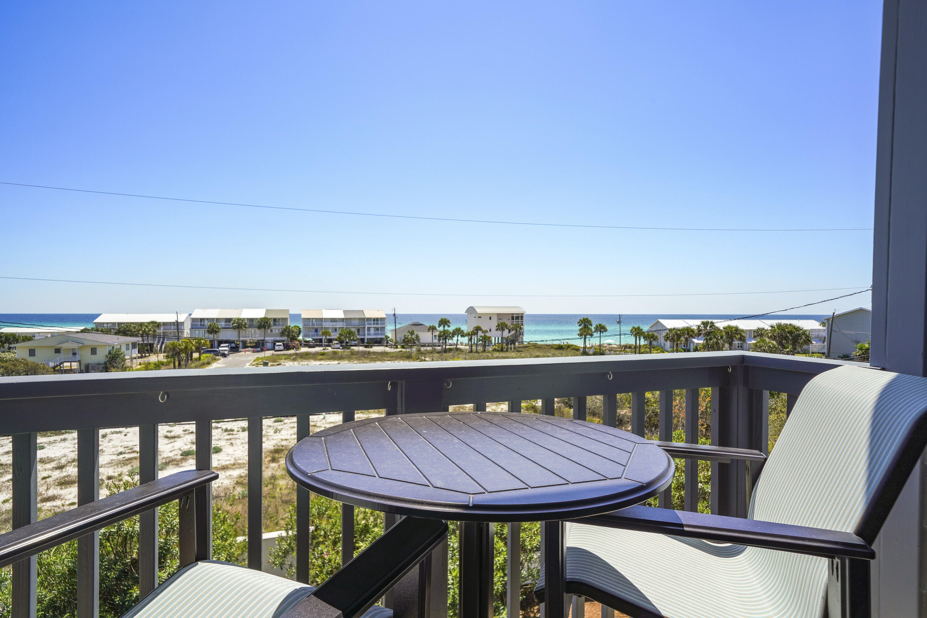 One block from the beach with amazing gulf views! This home features an elevator to all floors, private 1st floor fully-equipped apartment, private heated pool, heated/cooled 1.5 car garage, balconies on all levels, 2 kitchens, 4th floor tower, and hardwood flooring throughout. The 1st level apartment has a kitchen with everything you need including an ice machine, a full bath, french doors leading out to the pool area with built-in gas grill, and ample space to turn this into a game room or multi-bed bunk room. The 2nd floor is home to 2 Master Bedrooms, both with en suite baths and private balconies, and a Bunk Room with its own full bath. A 3rd Master Suite with private balcony can be found on the 3rd level, along with the main living areas. The oversized kitchen is outfitted with high- end appliances including a gas Wolf range, dual dishwashers, a built in wine fridge, and an ice machine. The open living and dining area allow for Gulf views from almost anywhere on the 3rd floor. Just off the living room sits a corner office with Gulf views that opens out to the covered balcony with cocktail table and stairs leading to the 4th floor viewing tower. Just steps to the Gulf, and quick bike ride to Rosemary Beach, this property could make a wonderful beach retreat used as a 2nd home or income generating investment property! Rental projections up to $170K