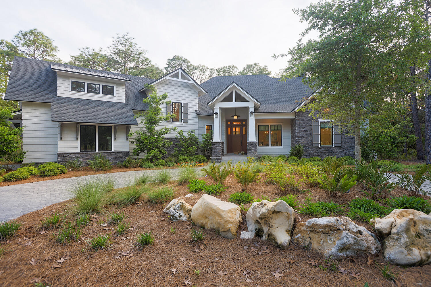 Escape to your own private sanctuary just minutes from the sparkling Emerald Coast beaches. Nestled on a rare 1.06-acre wooded lot backing up to a serene conservation area. This luxury custom 3 Bedroom, 3.5 Bath home in the exclusive gated community of Wild Heron offers the perfect blend of seclusion, sophistication, and coastal convenience. Spanning an impressive 3,506 Sq Ft of meticulously designed open living space. The thoughtful layout includes a versatile bonus room above the garage, complete with its own mini-split AC unit, offering flexibility for a home office, gym, or guest suite. The heart of the home is the gourmet kitchen, equipped with premium appliances perfect for culinary enthusiasts. Enhancing the living experience are smart lighting, a Samsung 76'' Frame TV, and a Sonos home sound system, creating an immersive and modern environment. For added convenience and enjoyment, you'll find an inviting wine room and a dedicated tech room to neatly house all your wireless equipment, router, and sound system components. Step outside to the expansive screened porch, an ideal space for outdoor living and entertaining, featuring a fully equipped outdoor kitchen, a dedicated dining area, and comfortable seating. The property also boasts a charming fire pit and carefully planned landscape and outdoor accent lighting, perfect for enjoying the peaceful evenings. The luxurious owner's suite offers a spa-like master bath, providing a private retreat. Throughout the home, you'll appreciate the modern touchless faucets in the bathrooms, as well as the efficiency of two tankless water heaters. The property also includes a double garage with a dedicated workshop area. Located on a quiet and private cul-de-sac and surrounded by the beauty of nature, this exceptional home offers a peaceful escape while still being conveniently close to the vibrant amenities and stunning beaches of the Emerald Coast. Enjoy the peace of a heavily wooded, gated neighborhood, where large estate lots are rare while staying close to the beauty, recreation, and vibrant communities of Florida's Emerald Coast. Wild Heron is a thoughtfully planned residential community that offers a wide array of resort-style amenities designed to enhance both relaxation and recreation. Residents have access to features such as swimming pools, a hot tub, a fully equipped fitness center, and well-maintained nature trails ideal for walking, jogging, or birdwatching. For water enthusiasts, the community provides kayaks and dock access to Lake Powellone of the largest coastal dune lakes in Florida, fish Powell Lake or the Gulf. Offering unique opportunities for boating, kayaking, paddleboarding to the beach. Located just minutes from the Gulf, Wild Heron also provides easy access to nearby public beach entrances. Its proximity to popular destinations such as 30A and Pier Park ensures convenient access to shopping, dining, and entertainment. This combination of natural beauty, recreational amenities, and location makes Wild Heron an ideal choice for those seeking a relaxed yet vibrant coastal lifestyle.