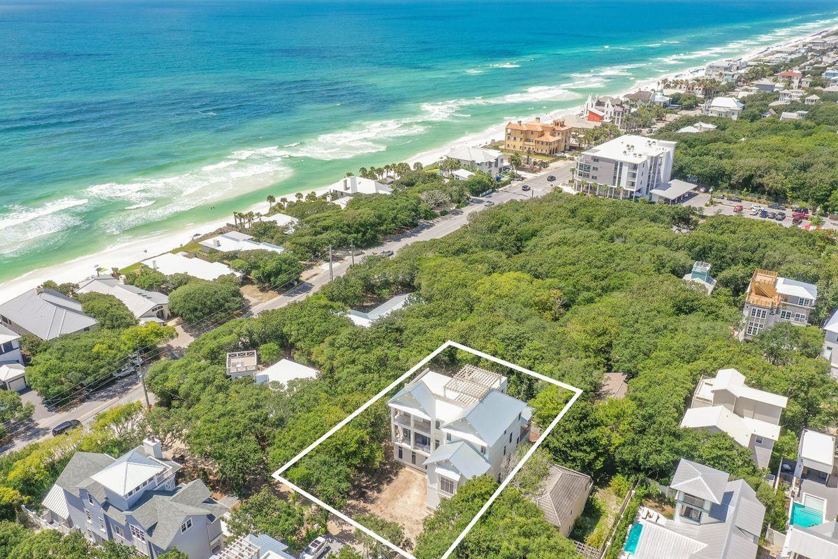 Exemplary coastal charm juxtaposed unparalleled panoramic gulf views with prominent positioning just two tiers off the beach the heart of Seagrove characterizes this new construction residence situated on an oversized homesite which offers over 5,600 sqft of pristine living space spanning an impressive four-story vertical footprint allowing for sweeping unobstructed vistas from the 700+ sqft top floor viewing deck. This 7 bedroom 8 bath home epitomizes 30A living and is estimated to be completed in Spring of 2021. 41 Azalea is prominently situated just two lots off the beach and perched at a high elevation presiding over a lower southern exposure which produces beautiful 360 degree gulf views that span from Destin to Panama City Beach as well as an incredible western/sunset orientation over Seaside.

Notable features include a private elevator, 12' ceilings, spacious watermark-designed pool area and adjoining spa complete with concrete block privacy wall & custom-built outdoor kitchen, oversized two-car garage, covered wrap-around porches with tongue & groove cypress accents, imported French-oak hardwood flooring on the second and third floor, durable Italian tile adorns the first level and wet areas. The open floor-plan accentuates this property's generous proportions & thoughtful design; the first floor features a spacious game/living room all of which is open to the rear pool deck, perfect for entertaining and complete with a wet bar & bunk spaces as well as a full king bedroom suite. The second floor is the epitome of open living with generous proportions including an open kitchen complete with Wolf & Subzero appliances as well as custom cabinetry artfully anchored by a hand made Francois & Co vent-hood. The second level also features a master suite & ensuite bathroom as well as a large bunk room or office space. The third level offers spectacular unobstructed gulf views highlighted by a large master suite complete with an ensuite bathroom that offers dual vanities, carefully sourced calcutta marble flooring, spacious walk-in shower and beautiful soaking tub. The third floor also offers three additional bedroom suites and spiral staircase access to the massive 724 sqft roof-top deck oriented to offer uncompromising sunset views and views over the Gulf of Mexico. Seagrove beach is located in the heart of 30A just East of Seaside & Watercolor. This home is enhanced by the new urbanism lifestyle it offers with close proximity to shops in Seaside town center, restaurants and local entertainment as well as the white sand beaches and emerald green waters of the Gulf of Mexico.
