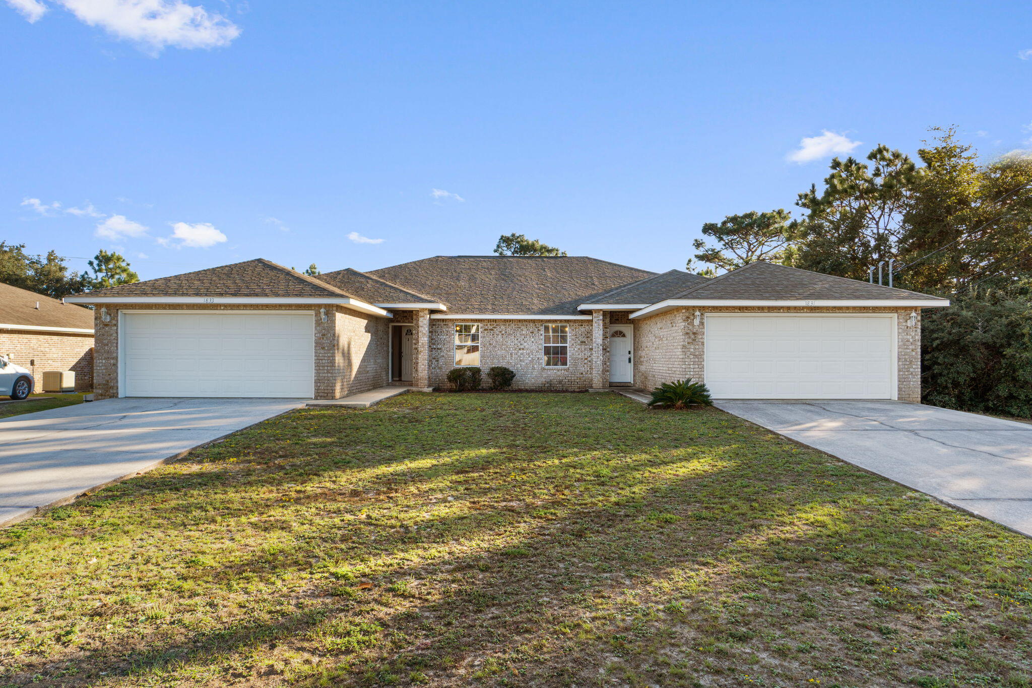 This duplex is a are investment opportunity in the sought-after Holley by the Sea neighborhood! It has been well-maintained and offers two vacant units—ready to rent immediately at current market rates. Each side features nearly 1,400 sq ft with 3 bedrooms, 2 baths each, a spacious living area, and a screened-in back porch. Both units are in good condition and fully livable as-is. Situated on a quiet street with access to HBTS amenities including pools, fitness center, tennis, pickleball, boat launch, and more. A fantastic option for house-hacking or expanding your rental portfolio!