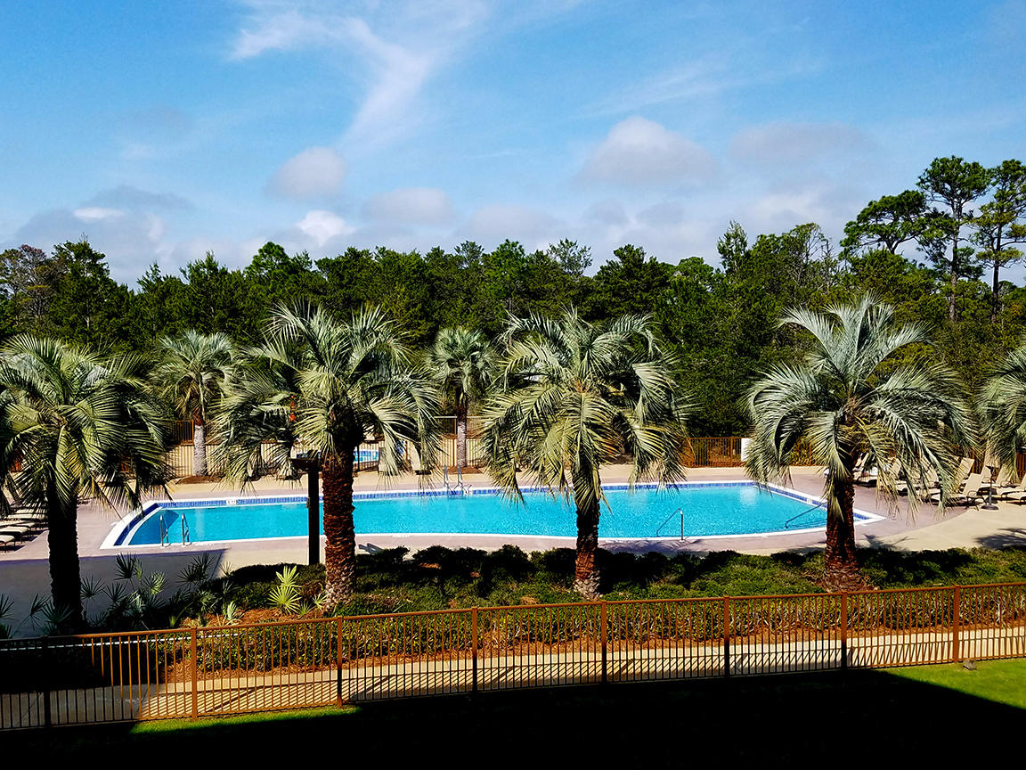 Great opportunity to own in wonderful Redfish Village, known for its stellar location and luxury without pretense. Enjoy the best of the 30-A lifestyle  beach, biking and nature - with private deeded beach access, a beautiful boardwalk access to a rare coastal dune lake, easy 30A bike path access, and the luxury of private covered parking in the heart of Blue Mountain Beach.
This 2 bedroom, 2.5 bath unit is in the prized M2 building overlooking the pool & event green and is being offered fully furnished and rental ready. The balcony offers a Southern exposure for year-round sun & privacy and a glimpse through the woodland buffer onto 30A. Luxury continues with Viking and Jennair stainless steel appliances, granite countertops, 11 ft ceilings, built-in hall bunks and owner's closet. This unit is located just around the corner from the owner's lounge which offers a fitness room overlooking the pool (treadmill, elliptical, bike & weight machine), a library loaded with bestsellers, a community room and separate theatre/media room with 65 in HDTV and cable for major sporting event viewing.
This unit (floor plan Unit B) currently sleeps 6 but could easily sleep 8 (with a simple change to convertible sofa in living room) and has rental projections of over $37,000 gross income annually. 
Redfish Village offers a fantastic location away from the crowds, a spacious feel, privacy, easy parking, and perfect proximity to the beach & fun. This eco-friendly community offers amenities including: free open-air beach shuttle (on demand â€“ so you come and go when you want to), covered loading zone with elevator and luggage carts, assigned parking and room for overflow, covered bicycle parking, two swimming pools (one heated year-round, the other heated seasonally), children's playground, manicured event green, private dock on Redfish Lake with great bass fishing, an on-site vacation rental company... in a village with only 80 residential units and a mix of retail and services. 
From Redfish one can easily bike to the local health food store & juice bar, bike shop, bakery, sushi, karaoke, Irish pub with game room and all of Grayton's best restaurants â€“ The Red Bar, Craft Bar, Chiringo, Abrazo, AJ's, Hurricane Oyster Bar, Grayton Corner CafÃ© â€“ and easily access the biking and hiking trails of Point Washington State Forest.
You and your guests will love experiencing the best of 30A here - luxury and location, peace and communing with nature, and of course... private deeded beach access! This unit has it all!