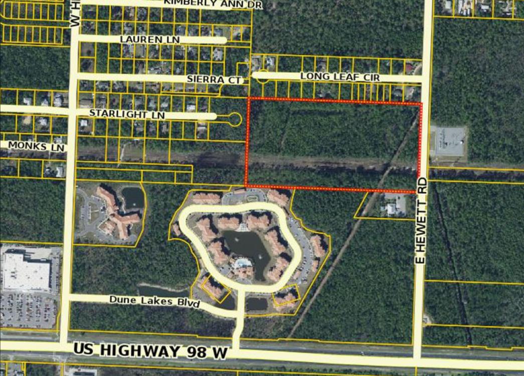 Large 20 acre parcel with 660 feet of frontage on East Hewett Road just off H'way 98 and close to Grand Blvd, Hospital, Publix, Walmart, Outlet Mall and South Walton Beaches. There are some wetlands and an easement with approx. 50% of the parcel being usable uplands. Zoned CR-2 allowing 2 units per acre.