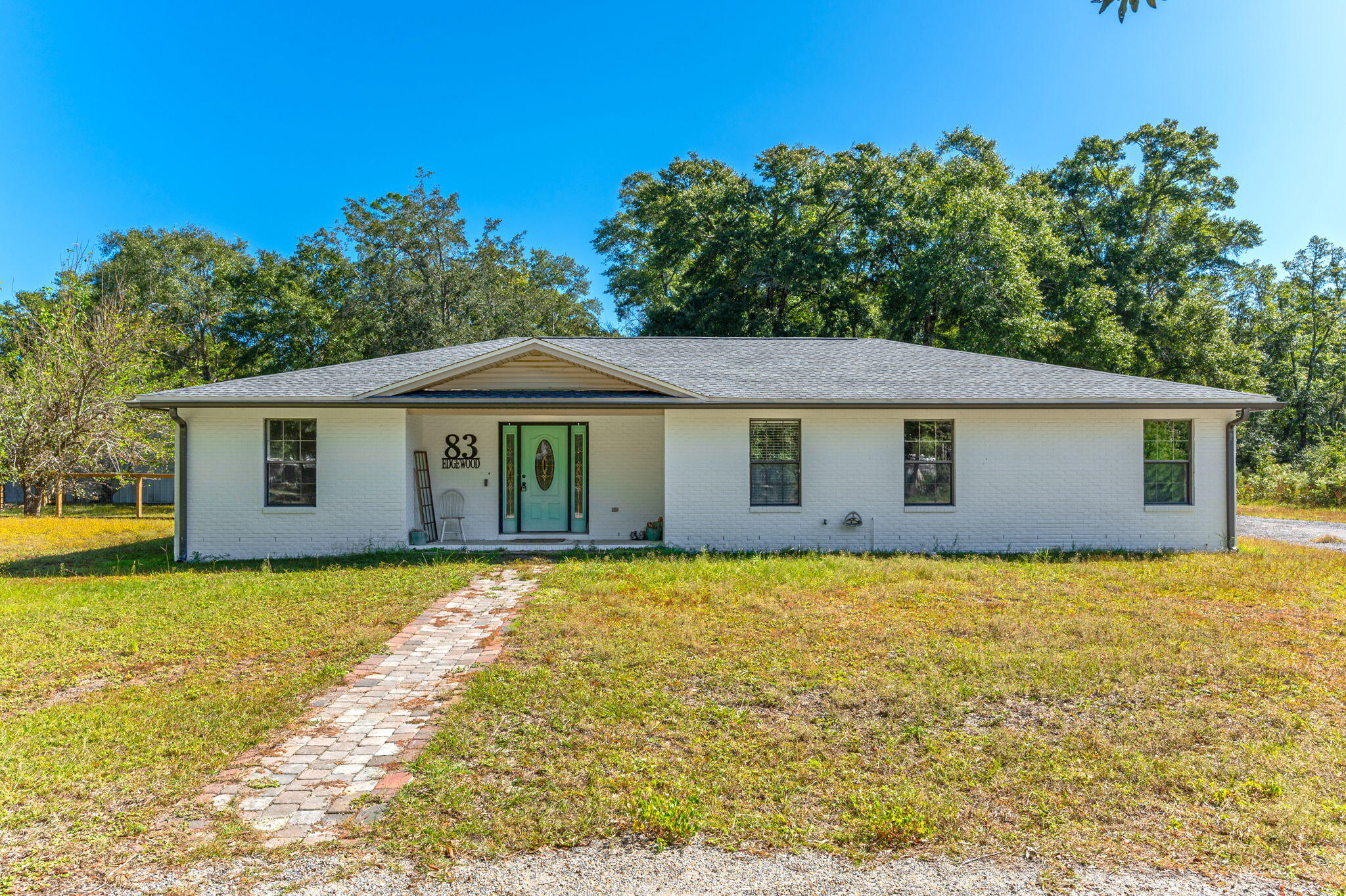 Prime Location! Less than 15 minutes to Freeport, Bluewater Bay, and Niceville. This 3-bed, 2-bath brick home with attached 2 car garage sits on nearly an half of an acre with no HOA. The open kitchen features oak cabinets and Corian countertops, flowing into a spacious living area. The master suite includes dual vanities, a walk-in shower, and his-and-her closets. Enjoy a landscaped yard with fruit trees. A must-see rental! Requirements include all adults having a credit score of 600 or better, one year on the job or employment offer letter and monthly household income of $6250.