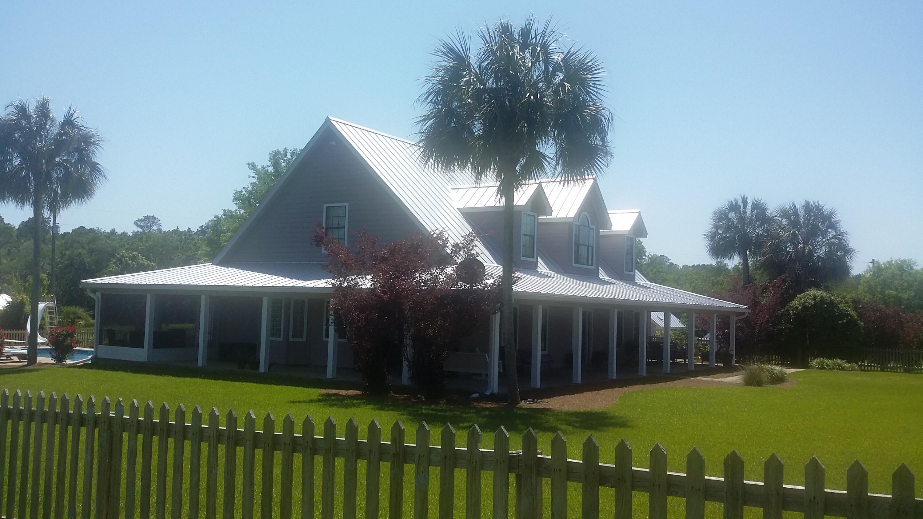 67 acres, with 2 ponds and your Dream Home!  Perfect location for the kids or grandkids complete with a 3,235 s.f. heated and cooled home with 6,196 s.f. under roof with porches and extras. This two story home built in 2003 has meticulously been maintained and taken care of.  Has large master bedroom and  master bathroom downstairs, with beautiful bath with jet tub, large double door walk-in shower and private commode closet. Own exit door to the back porch for that morning coffees that overlooks the pool.   Two (2) upstairs bedroom and extra Bonus Room.  Downstairs includes a spacious living room with gas fireplace and Cathedral ceiling, kitchen is a  ''Chef's Delight' with granite counter tops, island and hi-end appliances  CLICK ON MORE TO CONTINUE READING with formal dining room, foyer beyond.  Entrance from 2 car garage.  Large country front porch that overlooks fruit trees and grapevines, plenty of room for those family rocking chairs. Home has inside laundry/with full bath/shower mudroom --3rd bath. Screened in back porch with two sitting areas that overlook the inground pool.  Pool House just beyond, complete with paved sidewalks and arbor.   Property includes your 2 ponds, children's top-of-the-line playground/area, chicken yard, large metal workshop building for your tractor and other equipment.  Utility shed with bike rack near the garage. Home is completed with your very own storm cellar- with built in bunk beds, this home is the TOTAL PACKAGE!  This could be your family's own "Slice of Heaven".  Peaceful setting off paged road with paved driveway..