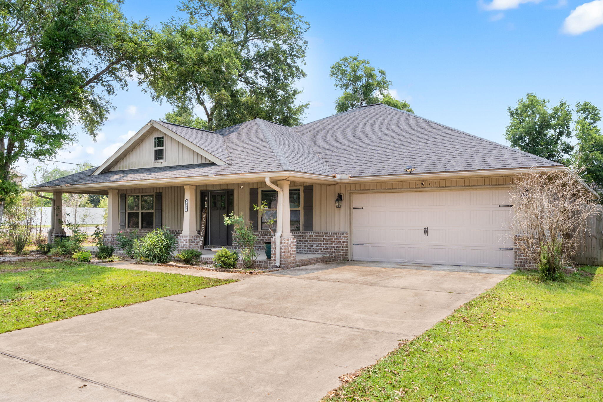 ASSUMABLE 3.5% VA LOAN!! This spacious 5 bedroom, 3 full bathroom home, built in 2020, is waiting for you! Situated on a generous sized corner lot - centrally located in Milton - just minutes from the Berryhill office and medical centers and shopping at the Merganser Commons. With an easy commute to I-10, and about 15 minutes to Whiting Field! Inside, this home offers over 2,700 sqft of living space. Including a formal dining room, ideal for gatherings or everyday meals, and an open-concept kitchen and living area that provides plenty of room to spread out. The primary bedroom is thoughtfully separated from the additional bedrooms, offering added privacy. A 2 car garage provides plenty of storage and parking, while the fully fenced in backyard and covered patio create a comfortab outdoor space for relaxing or entertaining. With no HOA - Enjoy the freedom and flexibility of no restrictions! Schedule your showing today, and make this house your HOME!