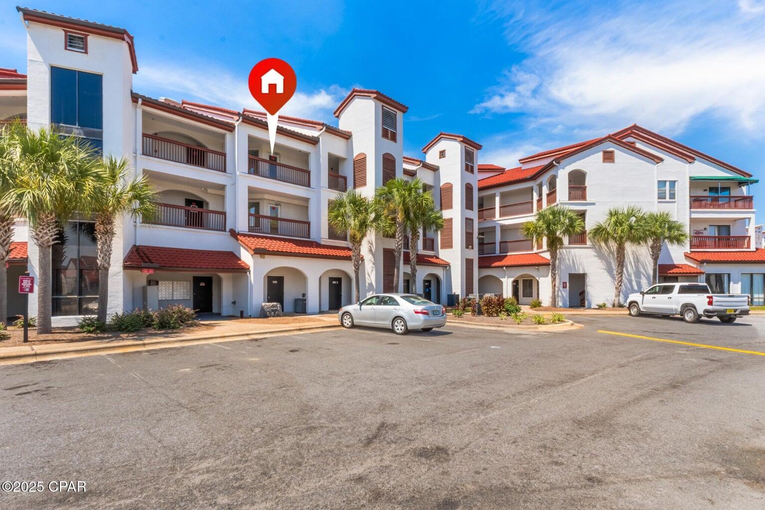 Tucked inside the gated community of the Plazas of St. Thomas, this updated third-floor condo offers the perfect blend of comfort, location, and resort-style amenities just blocks from the sugar-white sands of Panama City Beach. Inside, the one-bedroom layout features a light-filled living area and spacious bedroom with generous closet space. The kitchen is equipped with stainless steel appliances and flows easily into the dining and living areas—ideal for everyday ease or short-term rental potential. Step outside to enjoy your private balcony or explore the grounds, where a community pool, tennis courts, shuffleboard, dock, BBQ grill, and clubhouse invite relaxation and recreation. Residents also enjoy water, trash, exterior maintenance, and groundskeeping included in the quarterly HOA fee. Located just south of Grand Lagoon, you're minutes from beach access, St. Andrews State Park, restaurants, shops, and marina adventures. Whether you're looking for a full-time residence, vacation home, or income-producing property, this turn-key unit checks all the boxes.
