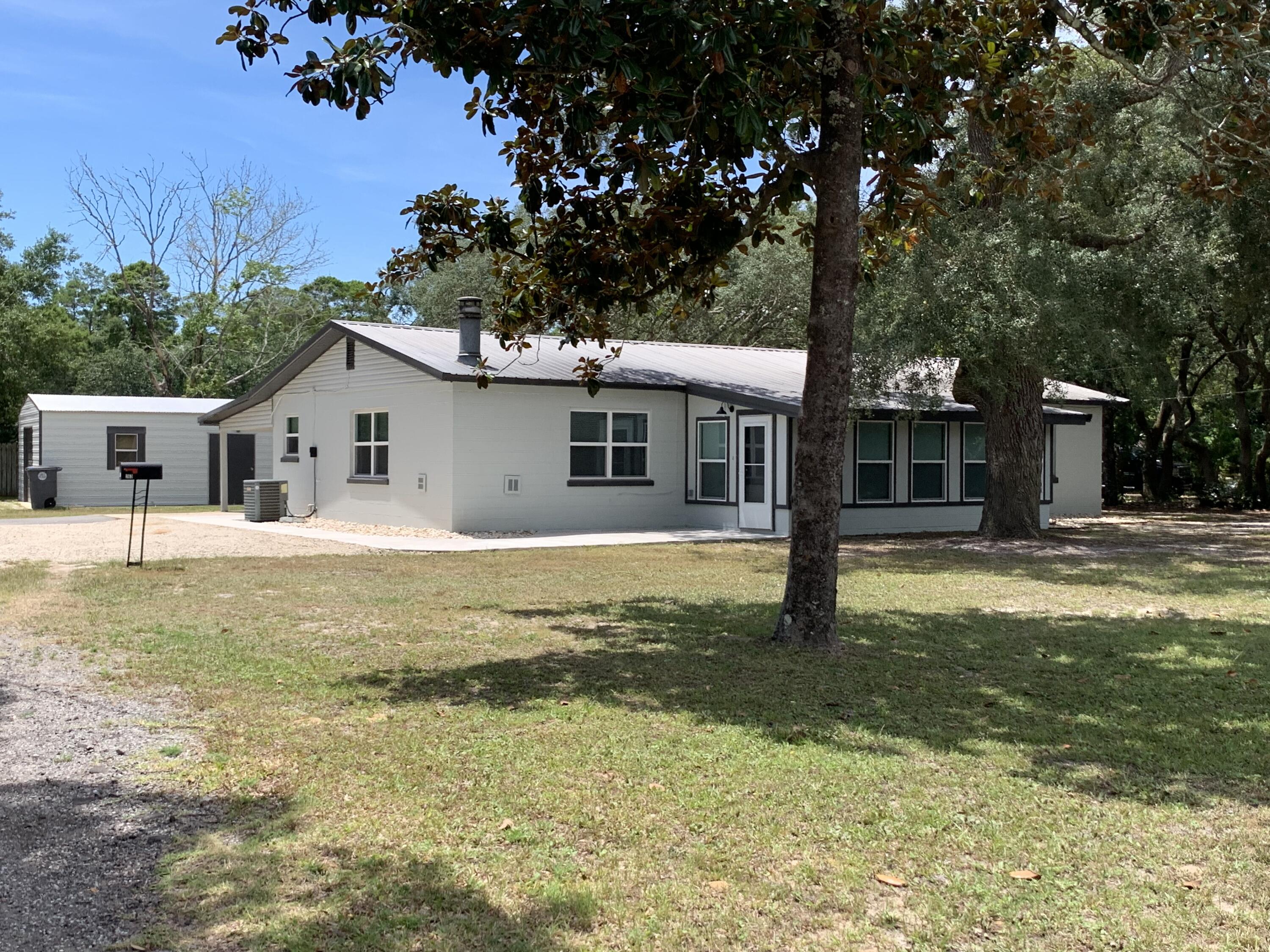 *Available to move-in immediately* 
Newly remodeled home located on a prime Valparaiso corner lot just a short distance to Lewis Elementary/Middle School, Tom's Bayou, Florida Park and just 3 minutes to Eglin's east gate. This home has beautiful tile flooring throughout the main living space, open concept kitchen/dining/living room, upgraded light fixtures, fully remodeled bathrooms with large showers, a sitting room in the master bedroom, newly added Florida room with heating/cooling, a cozy fireplace, brand new appliances, and a gas stove!! 
You'll be pleasantly surprised with the spacious lot and beautiful Florida tree in the backyard. Comes complete with a single car garage, single car carport, and 4 extra spaces outside! Pets considered with owner approval. Call Tiffani 850-797-0681.