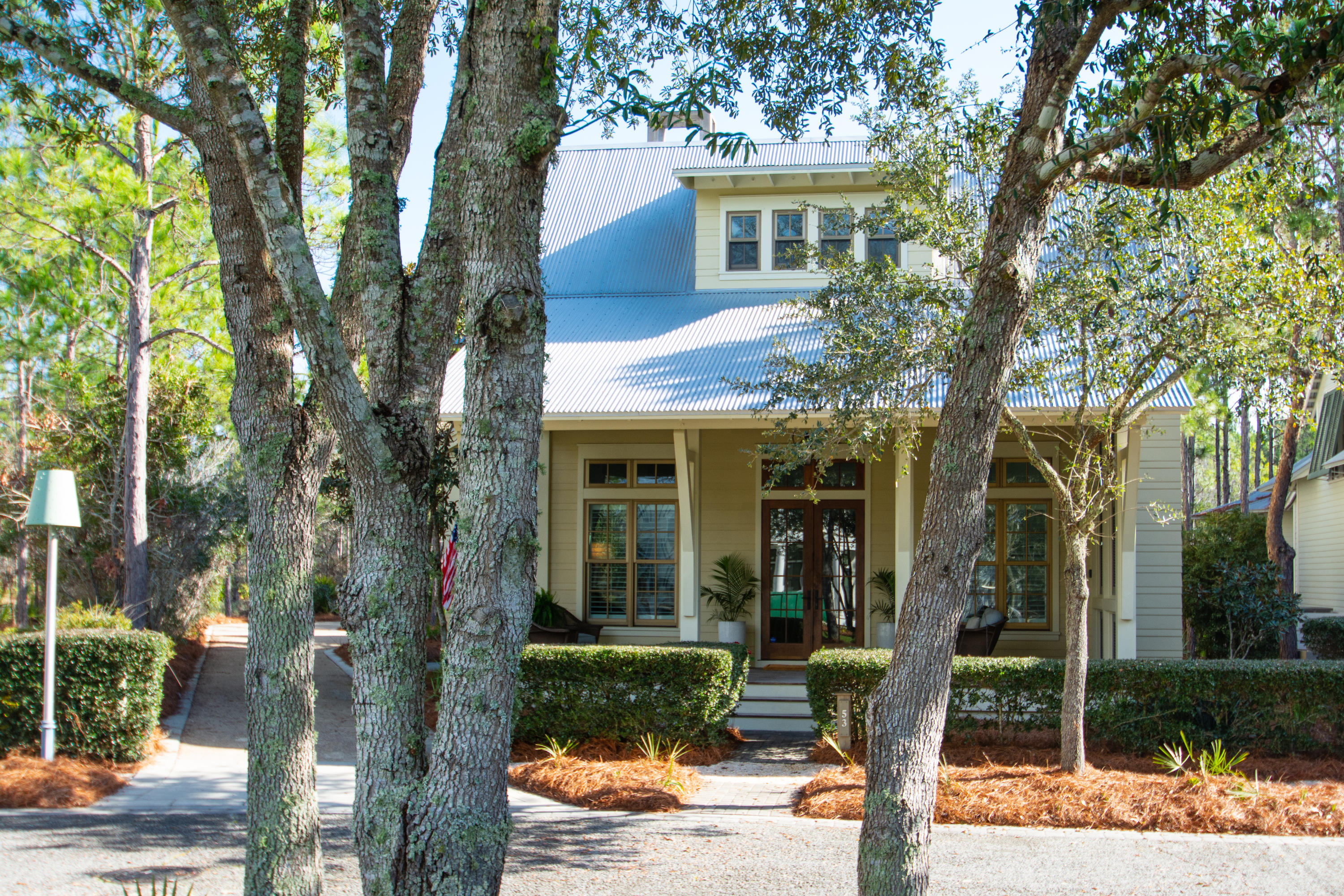 Peace and serenity abound in this original Geoff Chick designed WaterColor home, located in quiet area of Phase II with preservation area behind the expansive backyard. This is one of the largest homesites in WaterColor and also faces a lovely green park and has a circular driveway with room to add a garage with carriage house and even space for a pool!
The residence also has a chefs dream kitchen with professional appliances including large 6 burner stove/oven, warming drawer, 2 refrigerators, 2 deep farm sinks, a wine cooler and large Carrera marble waterfall countertop.
The 1st floor master suite has XL walk in closet, large shower and separate soaking tub. With the adjacent screened porch makes this an amazing and private retreat space. Also on the 1st floor is a large laundry/mudroom with side entrance for depositing pool and beach wear.  
The front porch welcomes you in to the front of the home where an extremely large living and dining room invites you to relax after your day of resort activities with the entire family.  In addition the side porch with its own fireplace is the perfect casual spot to indulge in your favorite meal fresh from the outdoor grill.
Three additional bedrooms, each with their own bathroom are just upstairs with one of the rooms being a large space for the kids to sleep, play and hang out.  The expanded Camp WaterColor is just a short walk away.
Original architectural plan for adding garage and carriage house is available.
This home is being sold furnished with a few exceptions.