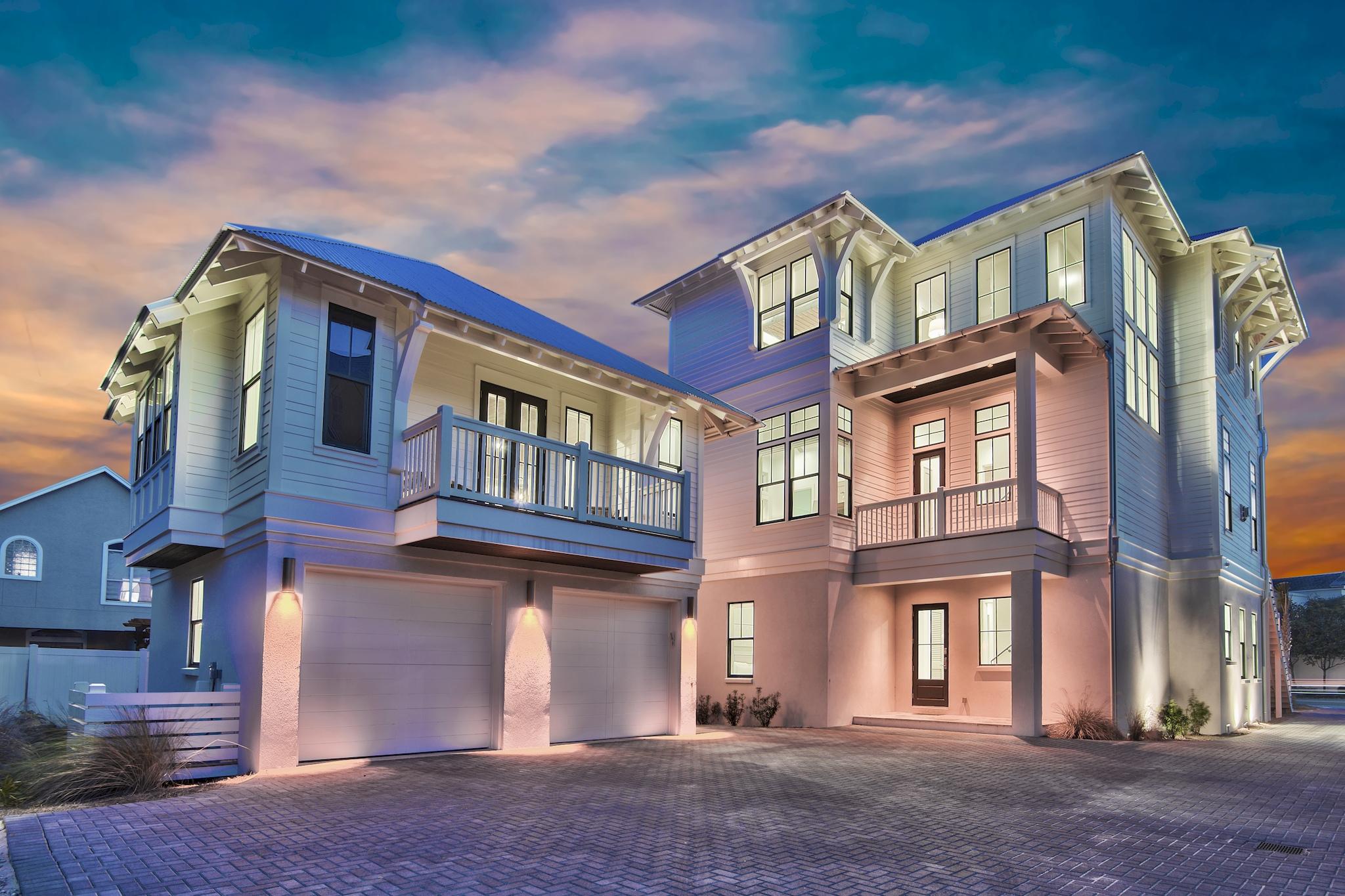 Luxurious coastal estate with sweeping panoramic ocean views that sleeps 30 is waiting for you in Seagrove Beach. Ultimate coastal chic design and architecture combined with vast outdoor decks with a private heated pool, and the prime location on 30A makes this newly constructed 3-story, coastal estate the ultimate beach paradise. Experience the essence of true coastal living in this state-of-the-art custom built, immaculate coastal property located in the heart of Seagrove. This coastal estate would make the perfect second home, permanent residence or vacation rental. Additionally, with nearly $275,000 in projected rental income solidifies the investment opportunity! $140,000+ on the books for 2021 currently. Featuring an expertly designed floor plan that flows harmoniously with the professionally decorated décor in neutral and crisp hues, vast outdoor decks and living space gives you unobstructed, breathtaking Gulf of Mexico views along with picturesque sunrises and sunsets, a cozy carriage house, private elevator, gourmet kitchen, and ample parking with a 2 car garage. This highly-desired location is approximately one mile from Seaside and Eastern Dune Lake and allows you to easily access the magic of 30A including being steps away from private deeded beach access that takes you to the sugar with sands of the glistening emerald coast waters, world-class shopping and dining, and ample outdoor activities.

Thoughtfully designed for entertaining friends and family boasting eight bedrooms and seven full and two half bathrooms. On the home's ground floor are three well-appointed guestrooms sharing access to living space and first-floor patio. The king bed guestroom offers a private bathroom with a shower. The bunk room features two built in queen-over-queen bunk beds, one twin-over-twin bunk bed, and a private bathroom with a shower/tub combo. The king bed guestroom serves as the home's second master bedroom and has a private en suite bathroom with a shower.

A spacious and modern open-concept floorplan gives a great flow to the home's second floor where you will find the large living and dining space with plush seating, hardwood floors and professionally decorated décor. The modern and crisp coastal design creates an inviting and bright atmosphere perfect for relaxing and enjoying time with friends and family. The gourmet chef's kitchen comes with sleek cabinetry and premium stainless-steel appliances, 48" gas Wolf range, 36" Sub-Zero refrigerator and freezer, 2 Asko dishwashers, and a large marble island equipped with a hammered stainless-steel farmhouse sink and extra bar space as well as a wet-bar, wine cooler and ice machine. Walk out of the expansive 20" glass sliding doors, that provide an abundance of natural light, and into your outdoor oasis with beautiful furnishings and a sparkling heated pool all set against the backdrop of Seagrove Beach. This level also features the home's stunning master suite, which features a luxurious king bed and a private en suite bathroom with a shower.

Take the private elevator or stairs to the third floor where you will find the remaining bedrooms, a large entertainment/living room, incredible porch with more stunning views of the Gulf! The master bedroom space and finishes offer exceptional luxury down to the beautiful vaulted ceiling, Gulf views, porch access, a spacious en-suite bathroom and expansive walk-in closet! Just off the master, you will find an additional living space featuring a wet-bar and porch access. An additional king bedroom and bunk room with two built in twin-over-twin bunk beds.

Located north of the main house is the cozy and private carriage house offering the ultimate spacefeaturing a kitchenette, a king bed guestroom, and a private bathroom with a shower/tub combo. This space also makes for great beach gear storage.
