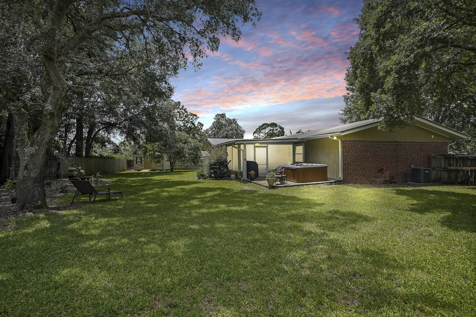 LOCATION & LIFESTYLE....This residential community is a comfortable, peaceful haven, yet perfectly situated to take advantage of all Fort Walton Beach has to offer. Easily accessible to Hurlburt Air Force Base, Minutes away from the beautiful beaches of Okaloosa Island, and within walking distance to theaters, cafes and restaurants. Situated on a cul-de-sac, this modish ranch style home has been modernized with an open concept kitchen featuring newer appliances, 2 living areas with plenty of entertaining space, updated bathrooms with stylish vanities and attractive flooring. Master bedroom has an en suite. Enjoy those summer days and cool nights relaxing and gazing from your family-sized Florida room.
There is 8x16 yard building out back to keep all your lawn and gardening tools
