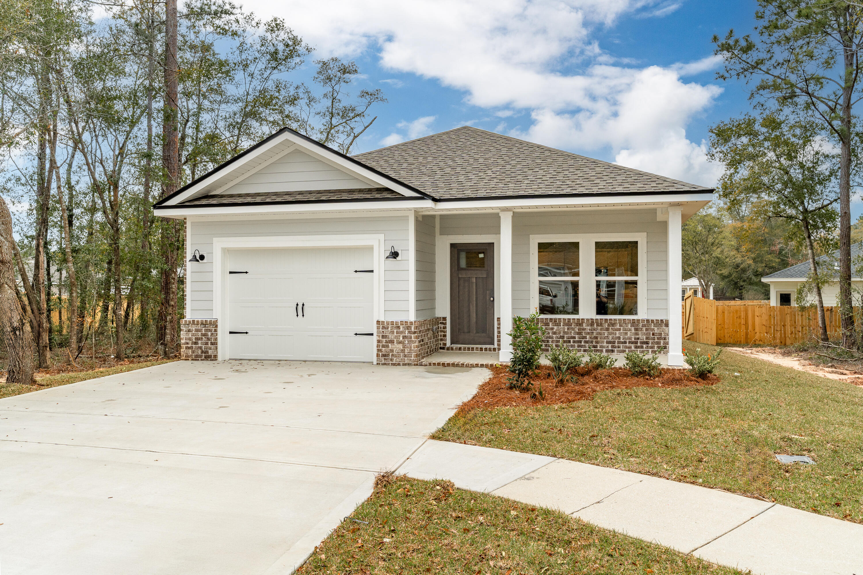 BUILDER/LENDER WILL CONTRIBUTE UP TO $15,000 TOWARDS CLOSING COSTS (restrictions apply-call for details-preferred lenders only). CRAFTSMAN STYLE 1314 SF home, 1 car garage, sprinkler system, fully landscaped with privacy fenced backyard, covered front and rear porches for relaxing! Open family/dining/kitchen with raised ceilings and recessed lighting.  Work island offers bar seating and has quartz or granite countertops.  Large walk-in pantry, stainless steel appliances and white shaker cabinets.  Owners' bath has tile shower, double vanities, walk-in closet plus linen storage.  Luxury vinyl plank flooring throughout.  Builder offers 1 year builder warranty. Ready now. Interior photos of similar sold home-colors will vary.