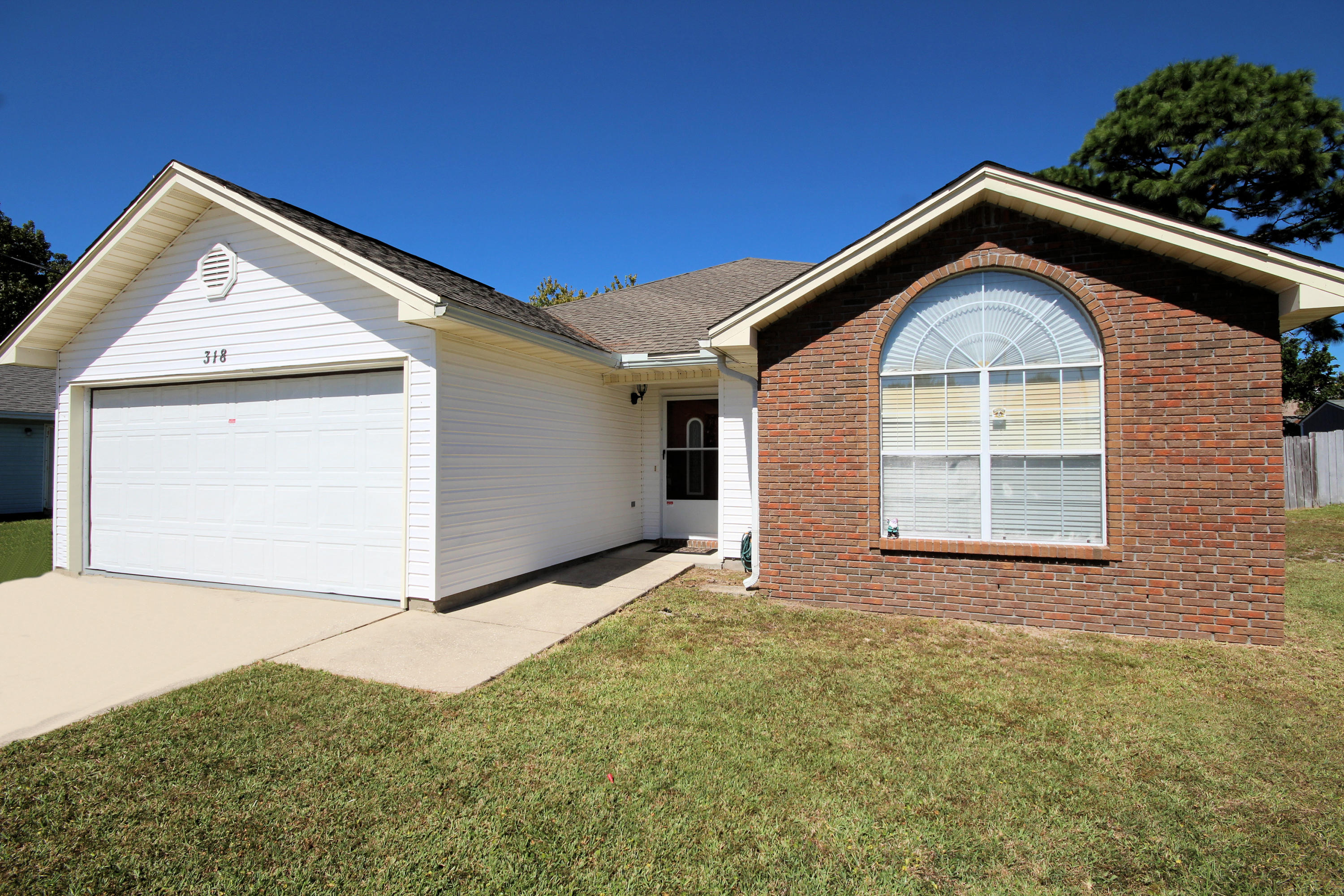 Great location! BEAUTIFUL HOME with an open floor plan and large backyard perfect for entertaining. Kitchen has plentiful 42'' tall cabinets, pantry and a stainless steel refrigerator. Kitchen is attractively angled and open to the dining room with an 8' breakfast bar. The great room features a wood-burning corner fireplace. Master bedroom has an arched window and cathedral ceiling. Privacy fenced back yard. Two car garage. Roof is 2005 and water heater is 2006.
