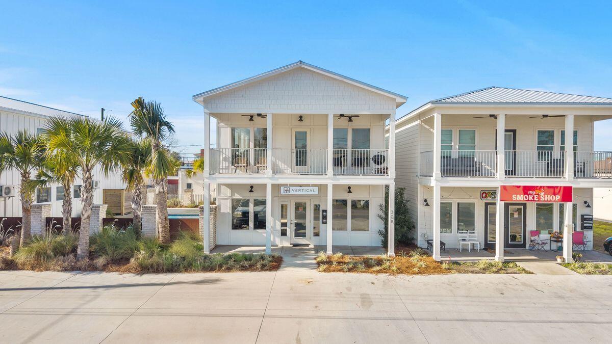 A rare opportunity to unite daily life and long-term value in one thoughtfully designed coastal offering. This mixed-use property presents exceptional flexibility for owners seeking both lifestyle convenience and income potential in a walkable downtown setting just steps from shops, restaurants, and the marina.

The ground level features approximately 1,000± square feet of commercial space designed as a true blank canvas. With strong visibility and adaptable layout options, it is well-suited for retail, office, studio, or professional use, whether owner-occupied or leased to generate additional revenue.

Upstairs, a private 1,500± square-foot residential retreat unfolds with an open-concept layout that supports both entertaining and everyday comfort. The kitchen flows seamlessly into the living area and features granite countertops, luxury vinyl plank flooring, storm windows, and brand-new appliances. Three well-proportioned bedrooms and two full bathrooms provide flexibility for family guests or a dedicated home office.

Short-term rentals are permitted, adding meaningful investment appeal. Residents also enjoy access to a newly constructed shared saltwater gunite pool offering an easy transition from productive days to relaxed coastal evenings. The property also offers the option to add a private pool, join a shared pool arrangement with joint tenants, or purchase multiple units for added value.

Built in 2024, this modern property delivers contemporary construction, clean finishes, and a versatile configuration rarely found in such a central location. It is a compelling option for those seeking to live, work, and invest with intention in one of the area's most desirable and accessible coastal settings.
