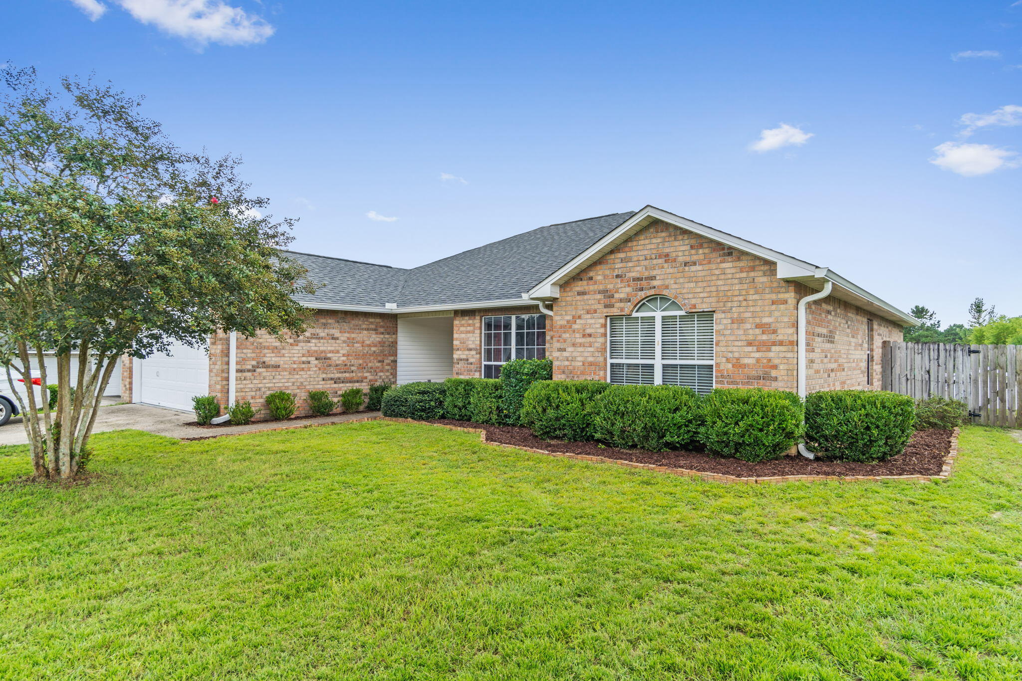 *Back on the market due to no fault of the Sellers!* Welcome home to this lovely all brick south Crestview home featuring 4 bedrooms, 2 baths on a 0.35 acre lot with no HOA! Have peace of mind with a brand new roof (installed 2021) and a new water heater that will be installed prior to closing. Pull up into the driveway and appreciate the well maintained landscaping that leads to the front door (Ring doorbell will stay with the house). Inside you'll find laminate flooring extending throughout the living room complete with a vaulted ceiling, freshly painted walls, and a fireplace. There is both an eat in kitchen space as well as a formal dining room and the kitchen is well appointed with stainless steel appliances (2018) as well as an updated faucet and new hardware.  Off the kitchen is an interior laundry room with a pantry/storage closet. Down the hallway you'll find four bedrooms. The first two guest bedrooms are nice sized with ample closet space and a full bathroom accessible in the hallway. The third bedroom (currently a nursery) is a great sized room with a spacious closet, and through that room you'll find the owner's suite. This layout is extremely convenient and perfect also for extend owner's usage like an office, game room, etc. Outside you'll enjoy grilling and entertaining on the nice sized covered back patio within the fully fenced in backyard. There's also a duck/chicken enclosure (ducks and enclosure can convey or can be removed) and a firepit you'll enjoy relaxing around. At the back of the property is a large storage building for additional use. Survey available. You'll love this location with a convenient commute to Eglin AFB, 7th Group, and dining and shopping options.