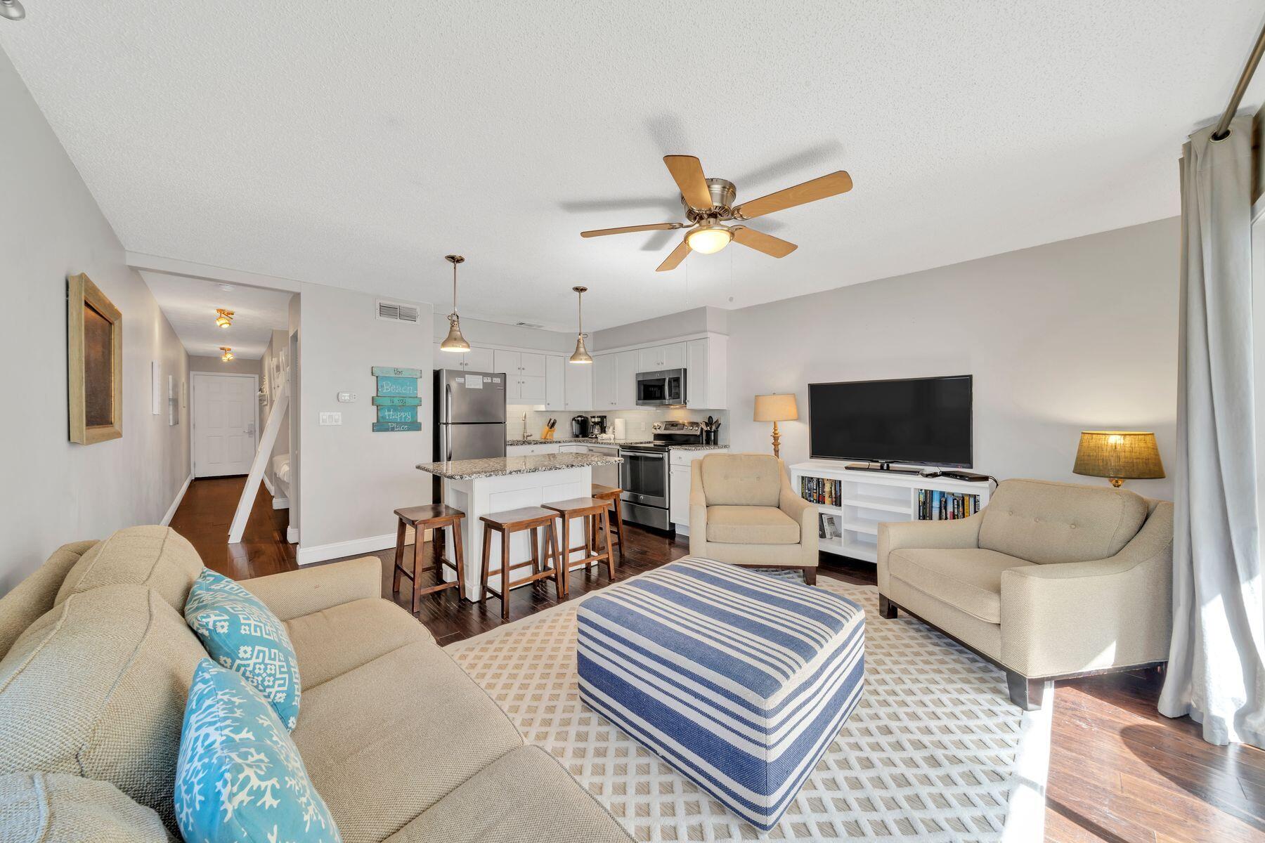 Price Improvement for this enchanting one-bed condo at Beachside captures the magic of the Emerald Coast beaches. The building is a short walk from morning strolls on the white sandy beach, enjoying the gently breaking waves of the Gulf of Mexico. Conveyed fully furnished, this home has rich hardwood flooring and tasteful décor echoing a beach vibe. Granite countertops and stainless steel appliances add an upscale tone to the generously sized open plan kitchen which includes an island breakfast bar for sharing drinks and snacks. The liveable floor plan effortlessly maximizes every space with a built-in bunk space in the hallway, sleeper sofa in the living room and mirrored storage in the master bedroom. Located on the second floor, the private balcony is perfectly aligned for enjoying every sunset from your own private space. This well-maintained gulf-front complex has lush plantings, a sparkling pool and BBQ area for socializing. Shopping and casual dining are right across the street and entertainment is a bike ride away at nearby Seagrove and Seaside, Florida. Not surprisingly, this beach condo has an excellent rental history currently on Vacasa's program and projections of $52,000 gross.