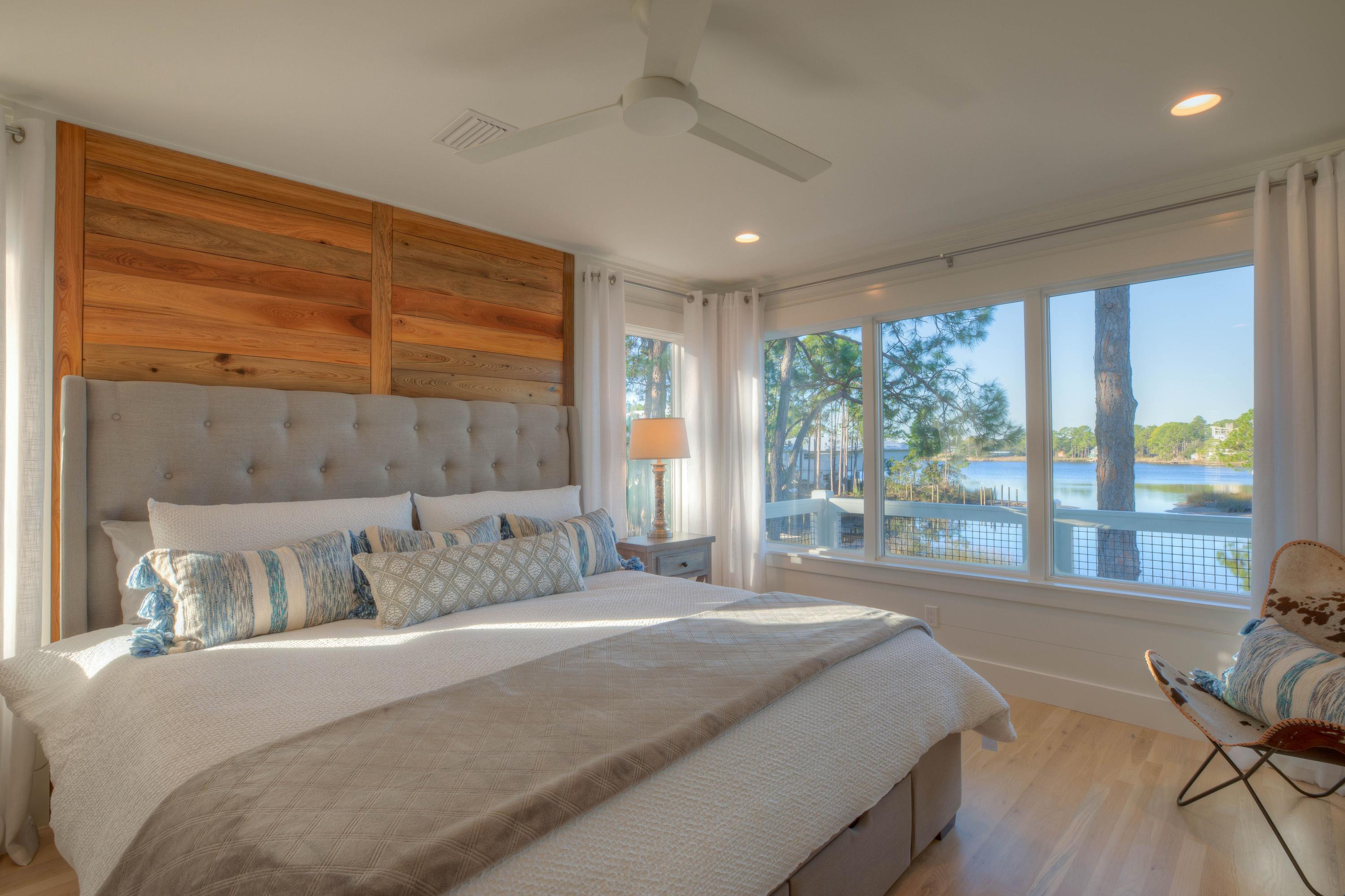 Look no further for the perfect lakefront residence! 100+ feet of frontage on Eastern Lake, south of 30A, fully remodeled 4 bedroom 3 1/2 bath fully furnished home, and a large, fenced, lakefront yard. Coveted western facing home has the most magnificent sunsets! After some skiing and wake boarding pull up your ski boat to your private dock and launch your paddleboard and kayaks. Experience the joy of arriving at the beach via your boat or paddleboard, it's the best way to travel!
Fully remodeled home was completed in January 2019. All new impact windows, beautiful hardwoood floors, all new kitchen and bathrooms. Everything in this house has been updated. On the main floor there is a living room with beautiful lake views with amazing sinker cypress accent with TV and fireplace. Sonos surround sound and smart security.  Lakefront master bedroom and bath is fit for a king, you have to see it to believe.  

On the first floor there are two extra deep garages with extra storage between.  One bedroom, full bath, laundry room and lakefront screened porch.  On the third floor there are two more bedrooms and a bath.

This listing also includes lot 20.  This lot is completely fenced and makes for a wonderful, huge yard.  Build the most amazing carriage house and pool, or hold on to it for an investment.  

Home or the lot can be purchased separately, contact listing agent for more details.  Owner is a licensed real estate agent.  All dimensions to be confirmed by buyer.