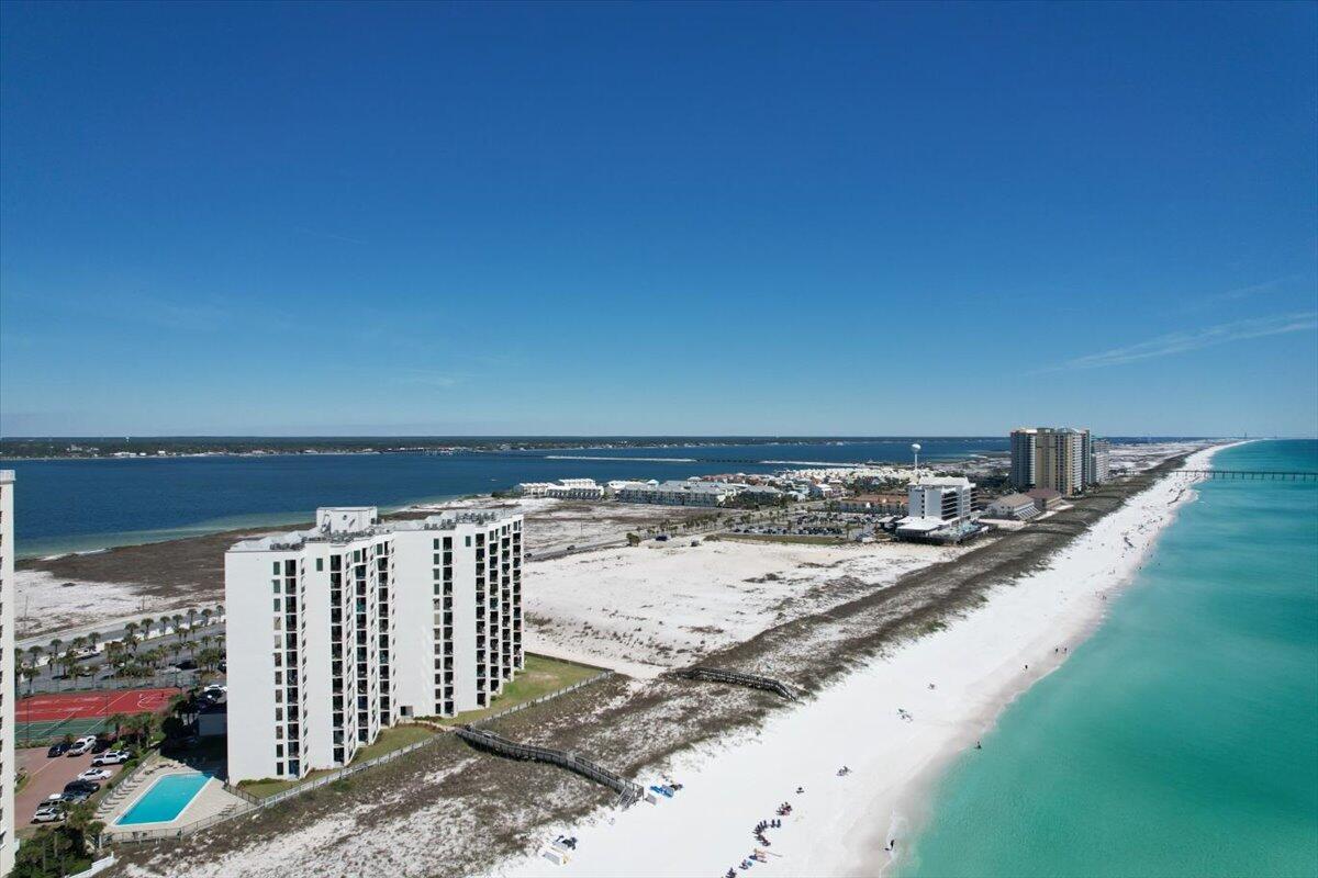Best Value in Navarre Towers!  Jaw dropping views of the Emerald Coast await you in this furnished luxury 2 bedroom, 2 bath condominium located on the highly coveted 6th floor of gated Navarre Towers.Regardless of which room you enter, stunning water views are sure to mesmerize you. Large balcony overlooking the Gulf of Mexico and the sugar white sand offers dual access from primary suite and great room.Indoor laundry with side-by-side washer and dryer, ample storage throughout, sizeable storage closet, and expansive bedrooms and bathrooms are featured in this exceptional home design. Navarre Towers owners enjoy exclusive amenities such as large community pool with ocean views, Tennis and Pickle Ball Courts, Shuffleboard, and Exercise Room.List of included furnishings to be provided upon request. Great Income Opportunity