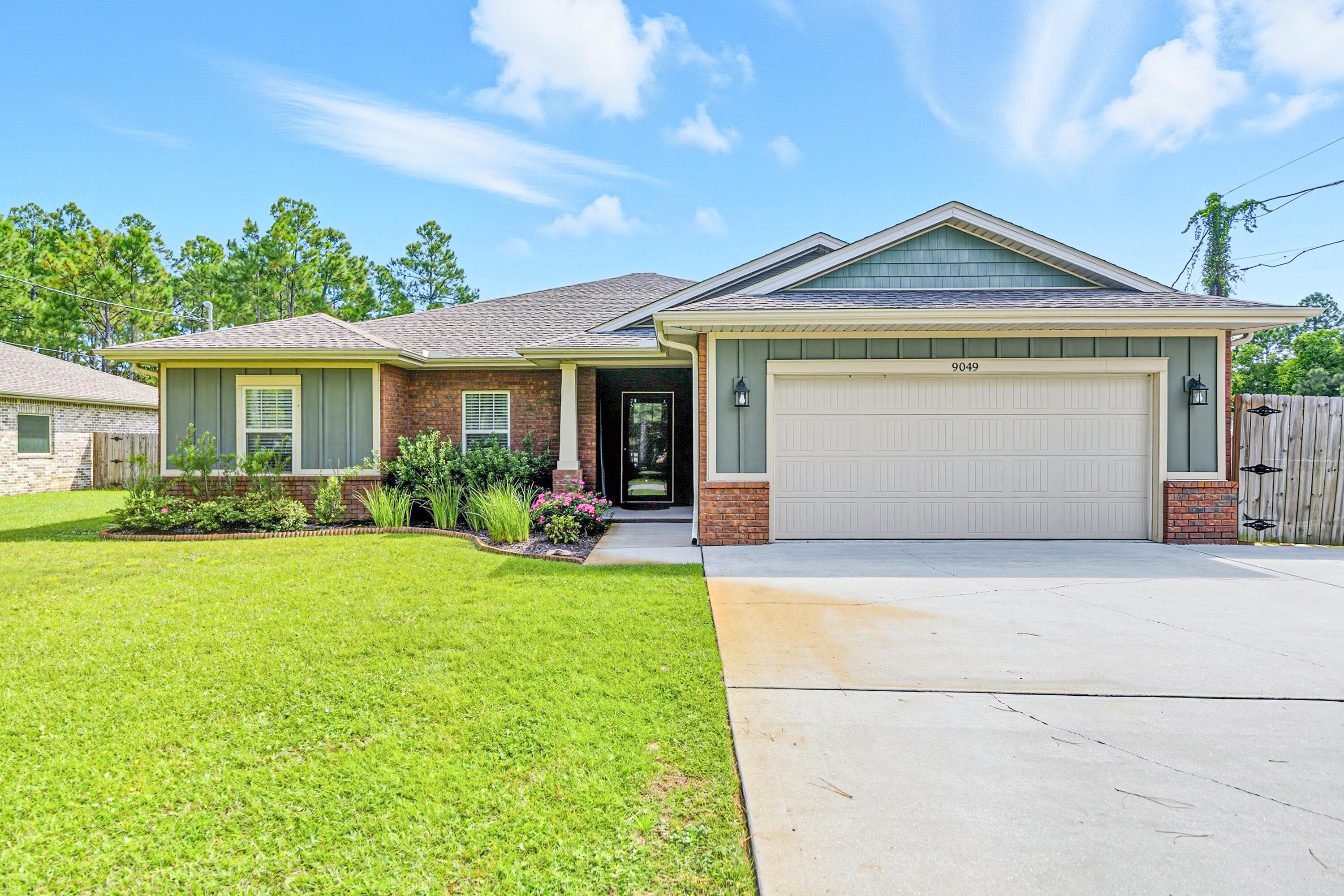 In a prime East Navarre location, this full brick Craftsman home sits on a generous size lot with 2,040 square feet, four bedrooms, two full baths, and a two-car garage. Built in 2019, it's been well cared for and recently updated with new LVP flooring throughout - no carpet to worry about. The open-concept kitchen and living area show off modern finishes and stainless appliances, making it an easy space to cook and gather. The master suite is a true retreat with a frameless glass shower, separate tub and shower setup, and a large walk-in closet. Outside, gutters have been added and the backyard is fully fenced, with the property stretching about 22 feet beyond the fence line. The covered patio is perfect for relaxing or entertaining, and the extended driveway concrete gives you plenty of room for a boat or toys. A partially floored attic above the garage adds bonus storage. Fabric shields are included for peace of mind, and this home is ready for its next owners to move in and enjoy.VA Assumable loan available at 2.87%.
