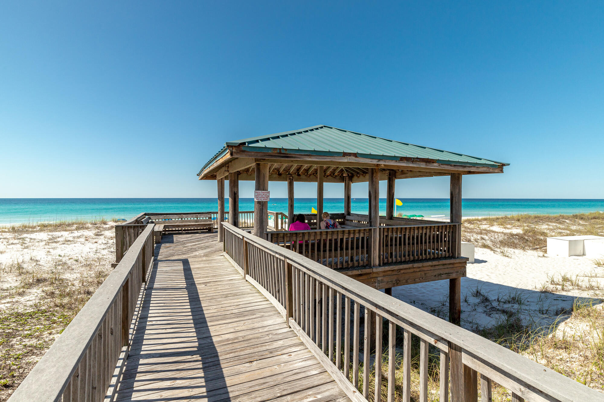 This fully furnished Unit 43 at Gulf Winds East has been thoughtfully updated and offers a spacious floor plan designed for both comfort and investment potential. The owner has recently installed new floors, and the unit features two master-sized bedrooms, two full baths plus a convenient first-floor half bath, a remodeled kitchen, and both porches and balconies with Gulf views. Its prime location near the pool and just steps from the beach makes it perfect for relaxing coastal getaways. With rental projections between $50,000 and $65,000 annually, this property is ideal for generating strong vacation rental income while still enjoying it as a personal retreat. Gulf Winds East provides private deeded beach access with a Gulf-front gazebo, offering a quieter, semi-private stretch  semi-private stretch of beach with fewer crowds than public access points. Perfectly located on Scenic Highway 98, the community is also within walking distance of popular local favorites such as Pompano Joe's, Captain Dave's on the Gulf, and Kenny D's Beach Bar & Grill.