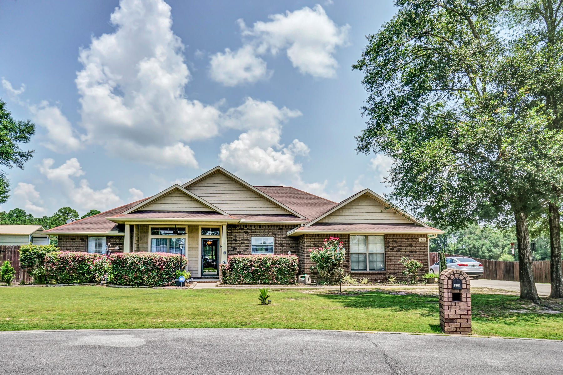 Beautiful brick home in Mossy Oak Plantation located on a 1/2 acre.  Enter a foyer to an open living room with electric fireplace. Relax on screened in porch and enjoy the peace and quiet of country living.  Owners have added a carport and cement pad for an RV in the back yard.  Living room opens to a dining area and breakfast bar at the kitchen c,ounter.  Beautiful stained wood cabinets, crown molding, soft close drawers, corner pantry and stainless steel appliances  compliment the pretty granitie counters in the open kitchen.  Luxury vinyl planking flooring has benn installed in main living areas for ease of maintenance.  Master suite with trey ceiling and crown molding adjoins Master Bath with double vanities, soft close drawers, garden tub, separate shower, and walk in closet. The large storage room, 10'x12', with a loft has been wired for electricity.