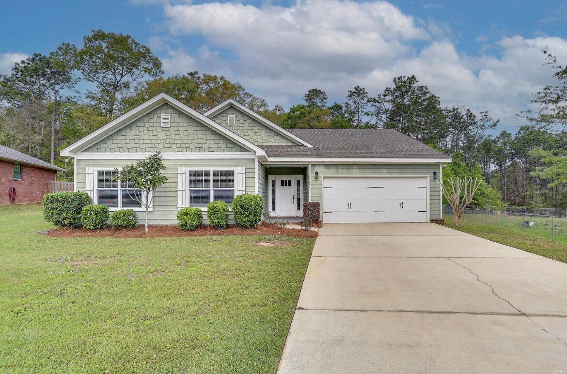 Beautiful and well maintained custom craftsman style home in the sought after Zachary Estates subdivision. Enter to find an open floor plan with a large great room and adjoining kitchen with a large kitchen island with dark granite counter tops. The kitchen is equipped with stainless steel appliances including a refrigerator, dishwasher, stove, and microwave that convey. The primary bedroom, great room,  and kitchen have dark espresso hardwood flooring while the additional bedrooms and primary closets are newly carpeted.  There is a covered back patio that is perfect for relaxing in your privacy fenced back yard.  Hot water was also recently replaced. This is a home that you don't want to miss out on!