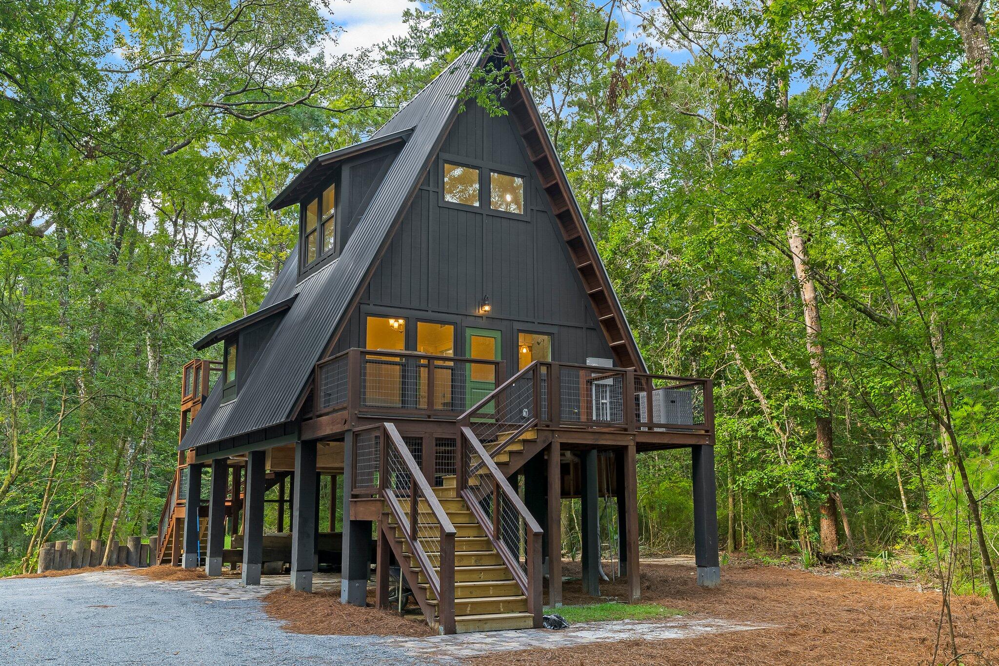 This stunning, brand new, tiny home is a modern farmhouse dream!! Located right on the Choctawhatchee River and in the woods, the privacy of your new home is a great escape from the busy, yet close enough to the beaches of South Walton and Panama City. Fully furnished, the main living area, kitchen and bathroom are on the second story with a large bedroom space on the third floor. Decks on both sides of the home and plenty of covered storage under the home. This home looks like it should be featured in a magazine with the attention to details and finishings selected.

***New photos coming soon!
***Loft access is by ladder or outside stairs The Beach Sunsets Inc. Resident Benefits Package is designed to provide convenience and professional services to our residents. By applying, Resident(s) agree to be auto-enrolled in the program and pay an additional $25.00 each month, payable with rent. Benefits of this package may vary due to the property specifications. No discount will be given if an element of the package is not available. The cost of this package is all-inclusive.