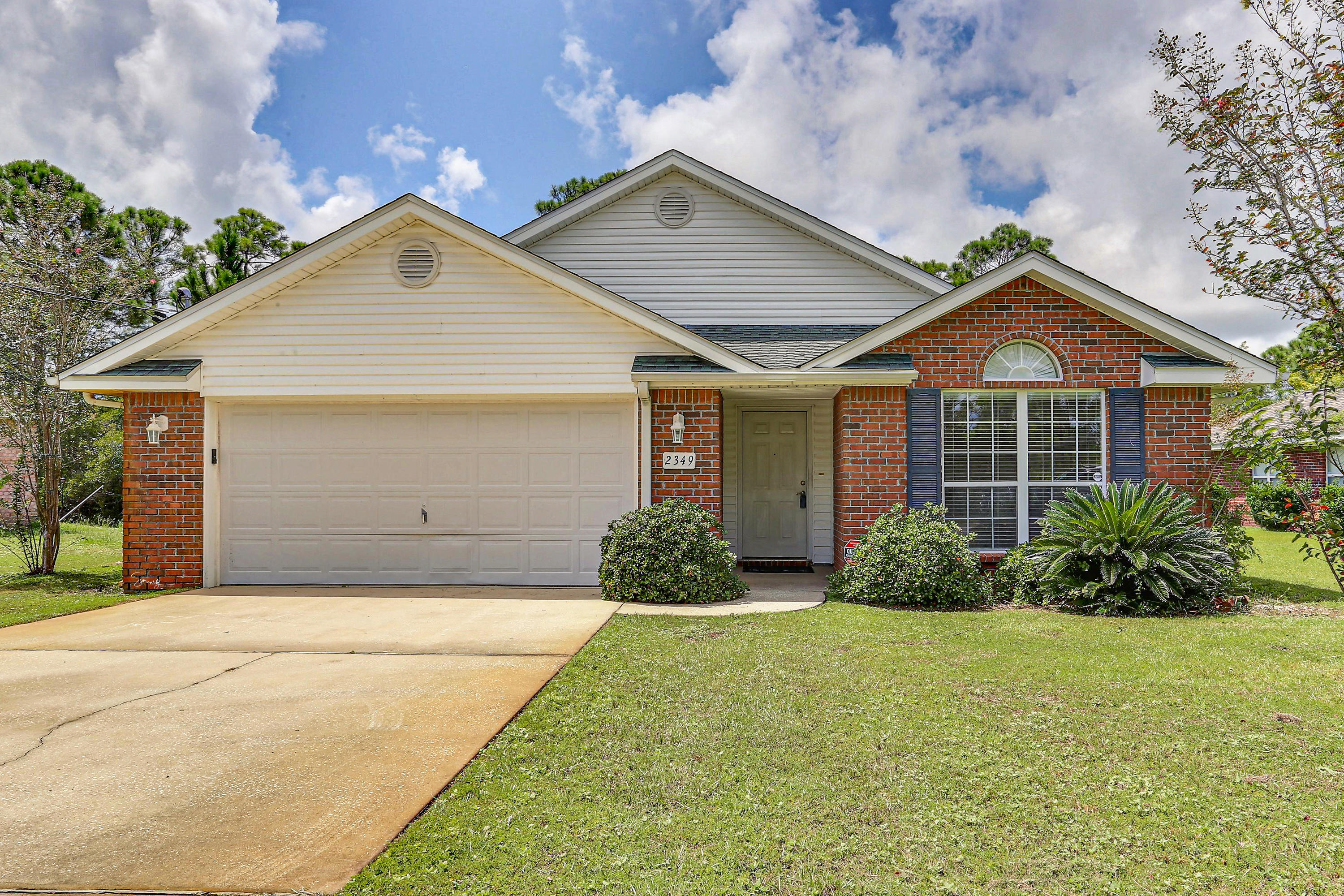 This well-maintained single-occupant brick siding home is ready for a new owner to take it to the next level. Featuring a four room, open design with vaulted ceilings this home has spacious living areas with both formal dining space and an eat-in kitchen. The kitchen is loaded with fine finished stained cabinets and counter space and features an island with a sink and dishwasher. The kitchen is also open to the family room which features a wood-burning fireplace. The roomy bedrooms are spaced in three different areas of the home. The large master suite features a walk-in closet, a master bath with a separate shower, garden tub, dual vanity, linen closet and a separate water closet. Windows tilt-in for easy cleaning and maintenance. Ceramic tile in the foyer and around the fireplace. Lawn pump and sprinkler system support the well established landscaping.