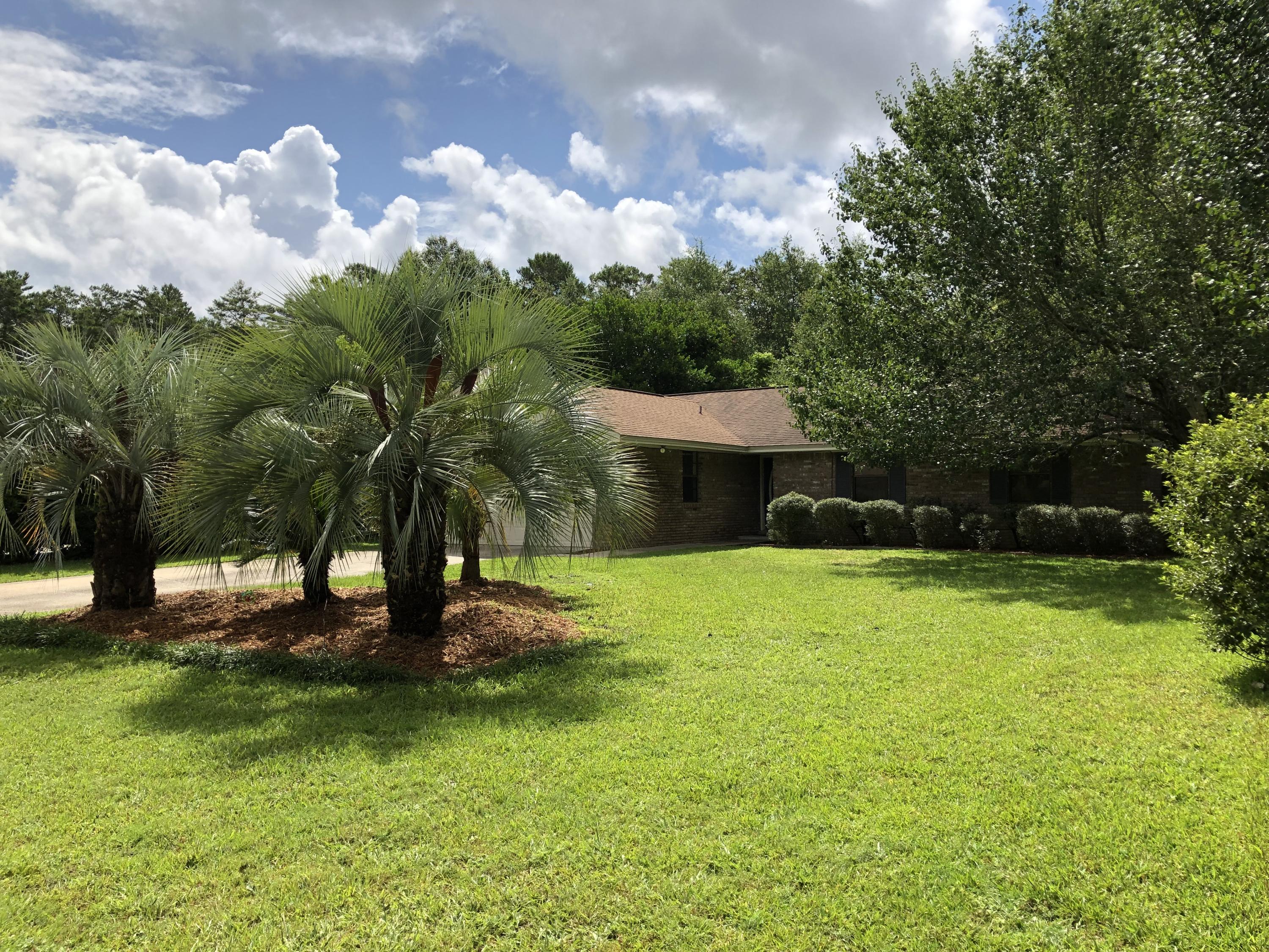 Drumroll!!!!! This is the home you are looking for! A home for any one in any walk of life! Located in Bluewater Bay and a short walk to shopping and restaurants. Lovely 3 Bedroom, brick home with fireplace, large living room with hardwood flooring. No HOA! On a Cul-de-sac. No popcorn!! Eat in Kitchen!! Large master bedroom and bathroom. Lovely mature back yard with scented wisteria covered arbor over the patio. Yard is very private and fully enclosed with privacy fence. No back yard neighbors! Japanese Magnolia. azaleas, kumquat, hybrid lime and loquat trees. Yard building with electricity and wood flooring! Flood lights in back and front with switches in kitchen and master bedroom. Room for a pool! Home warranty provided.
