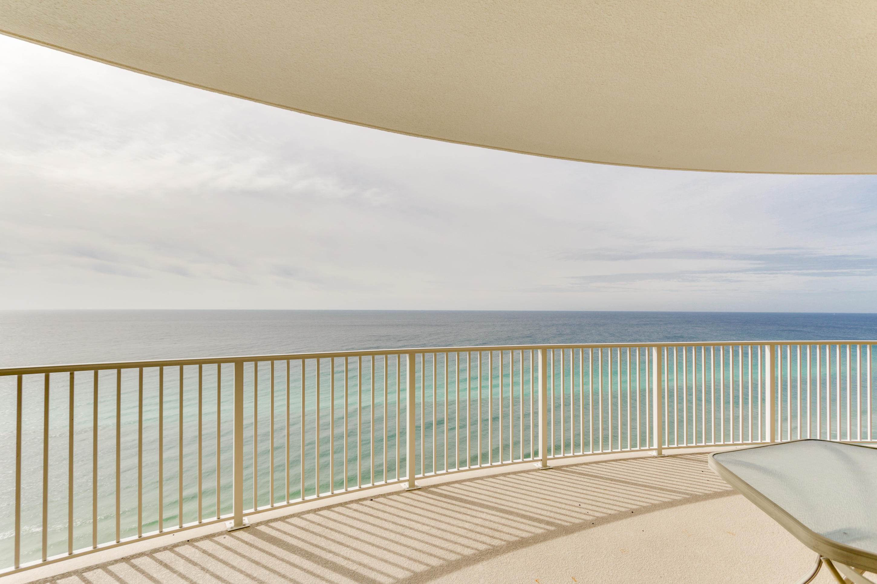 *Your own private assigned under-building parking space! This beach inspired Gulf front 2/2 condo at Emerald Isle is the beach getaway you have always dreamed of! The gourmet kitchen features granite counters and loads of cabinet This condo lives large and is spacious and bright! Master bedroom on the Gulf with access to the balcony through sliding glass doors. Gulf views from master bedroom, living room, dining area, & kitchen! Sunshine and warm gulf breezes abound from HUGE (10X28) BALCONY offering panoramic views as far as you can see to the East and West and providing the ultimate alfresco living and entertaining environment. Amazing water and beach views! * Lowest HOA dues on the beach. Owner's pets are allowed.