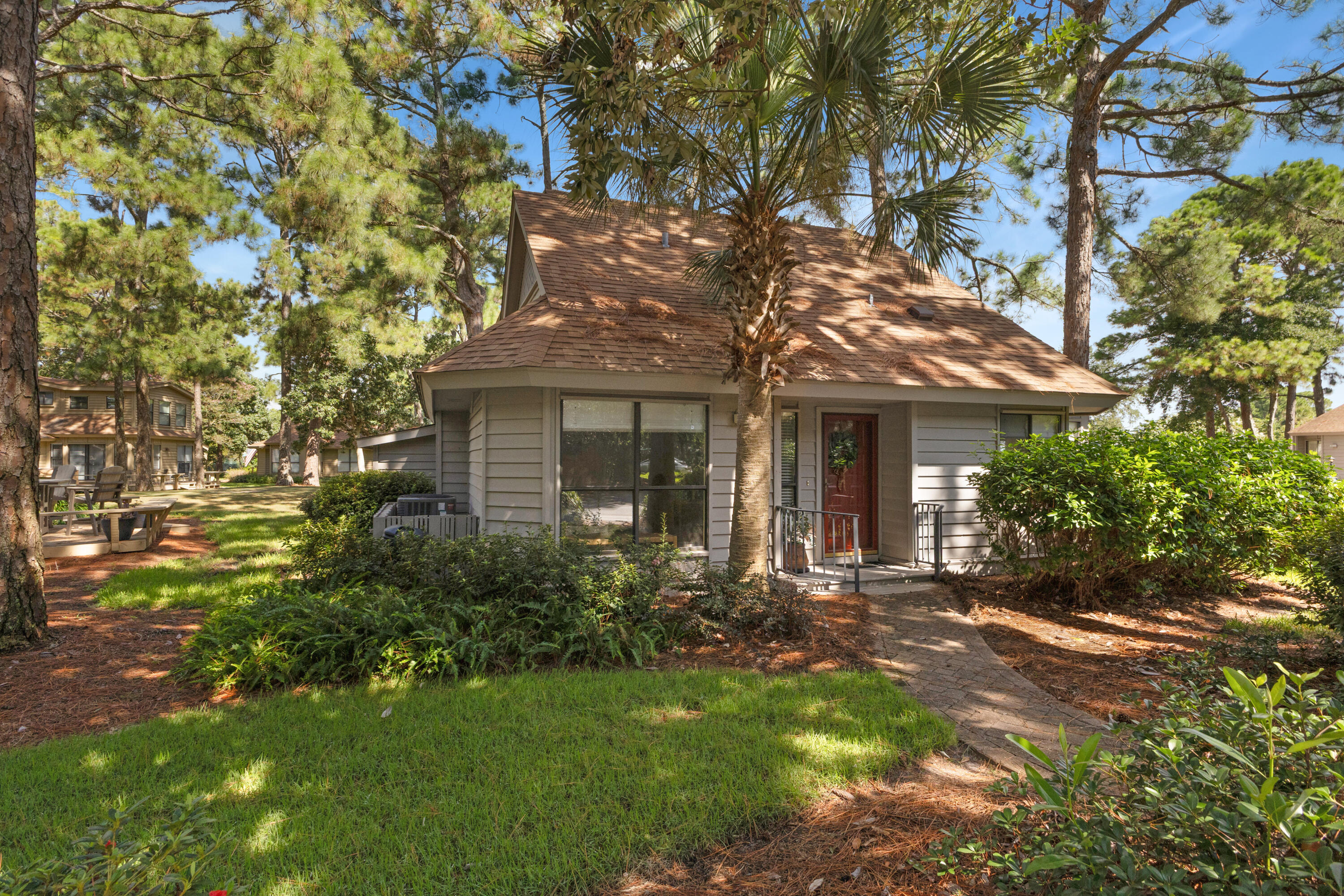 NEW VANITIES AND FIXTURES IN ALL 3 BATHROOMS! New glass shower doors in 1st floor bathrooms, new glass in 3 windows and living room slider doors. Easy Show vacant! Charming Cottage in the Fairways of Sandestin Golf & Beach Resort!! 1,777 sq feet, beautiful Bay Views! Tucked away on a peaceful wooded corner lot, this rare Fairways cottage offers a perfect blend of privacy and resort living. Located just off the 8th tee box of the Links Golf Course, the home's spacious screened porch and deck provide beautiful views of the fairway as it stretches toward the Choctawhatchee Bay. In the evenings, you'll be treated to the most spectacular bay sunsets. Inside, the 3-bedroom, 3-bath layout has been thoughtfully maintained by its original owners. Previous updates include all-new plumbing, a roof replacement in 2016, HVAC in 2013, and a master bath renovation in 2016, HVAC in 2013, and a master bath renovation in 2015.

Ample interior storage plus an additional outdoor storage room make it easy to keep everything from bikes to beach gear organized.

A short golf cart or car ride takes you to all of Sandestin's incredible amenities, including pristine beaches, championship golf, world-class dining, shopping, and entertainment. This is a rare opportunity to own a beautifully kept home in one of the area's most desirable gated golf course communities.

Fairways owners enjoy access to the two heated SOA pools: One across from Linkside Village on Audubon Drive (Currently Under Construction) and the newly constructed Phil Hummel Aquatic Center centrally located at the Baytowne Ave Traffic Circle.

As an introduction to the Sandestin lifestyle, we invite our new owners to explore amenities that make Sandestin special. The listing brokerage and seller(s) are presenting the buyer(s) of this property with (2) 90-minute rounds of Tennis court time, a golf foursome at one of our three championship courses, and a round of golf for up to four (4) players at the unrivaled Burnt Pine Golf Club.

Sandestin Golf and Beach Resort features more than seven miles of beaches and pristine bay front, four championship golf courses, 15 world-class tennis courts, a 226-slip marina, a fitness center, spa and celebrity chef dining. Shop, dine and play at the charming pedestrian village, The Village of Baytowne Wharf and more. Inside the gates of the resort, residents enjoy a balanced lifestyle of high-class living, spanning the 2,400 acres from the beach to the bay. Everything within the gates of the resort is accessible by golf cart or bicycle. The entire resort is interconnected by miles of pedestrian, bike and golf cart paths that weave through groves of live oaks, meandering past natural lagoons, fountains, man-made lakes, and meticulously landscaped fairways.