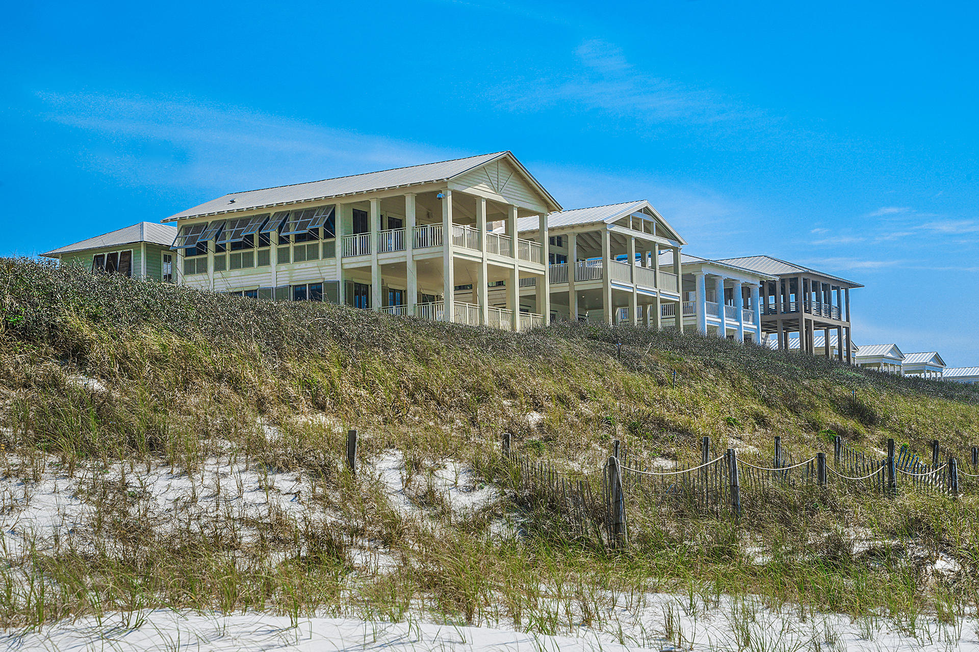 This beautiful gulf front residence, ideally located in the heart of iconic Seaside, is a must see! With its chic design elements and classic coastal look, this home embodies the 30A Life. With three floors, four bedrooms, four and a half bathrooms, an enormous amount of indoor and outdoor living space, an elevator, two laundry rooms, and of course, truly remarkable views, this property is sure to impress. The first level offers a spacious master bedroom with ensuite, large walk-in closet, and private porch access. A large bunk room, bathroom, and laundry room are also located on the first level. The second level offers a second master suite with a large private porch, a guest bedroom with ensuite, and a second laundry room. On the third level, a spacious living area opens to a generous dining area and a well-appointed kitchen, complete with Sub-Zero and Thermador appliances, while a large number of windows and doors provide an abundance of natural light and breathtaking views from almost every vantage point.