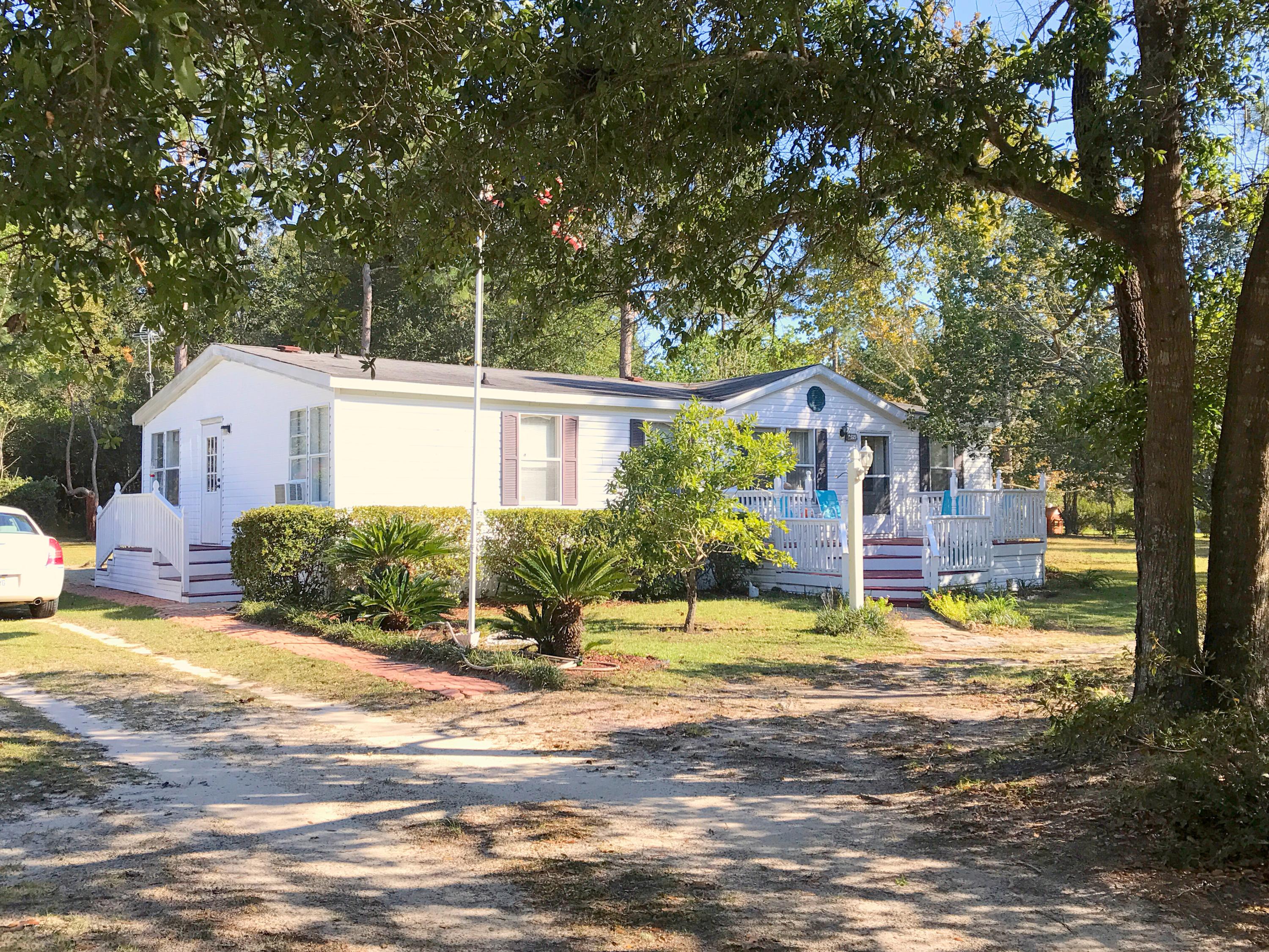 This manufactured home has been very well taken care of. It is located on over half an acre very close to Juniper Lake. It has an open floor plan with a large living area. Spacious master bedroom and bath with shower and separate garden tub. Split floor plan with 2 bedrooms and full bath. The yard is very well manicured with outdoor storage shed. Seller is also offering a new HVAC with full price offer!