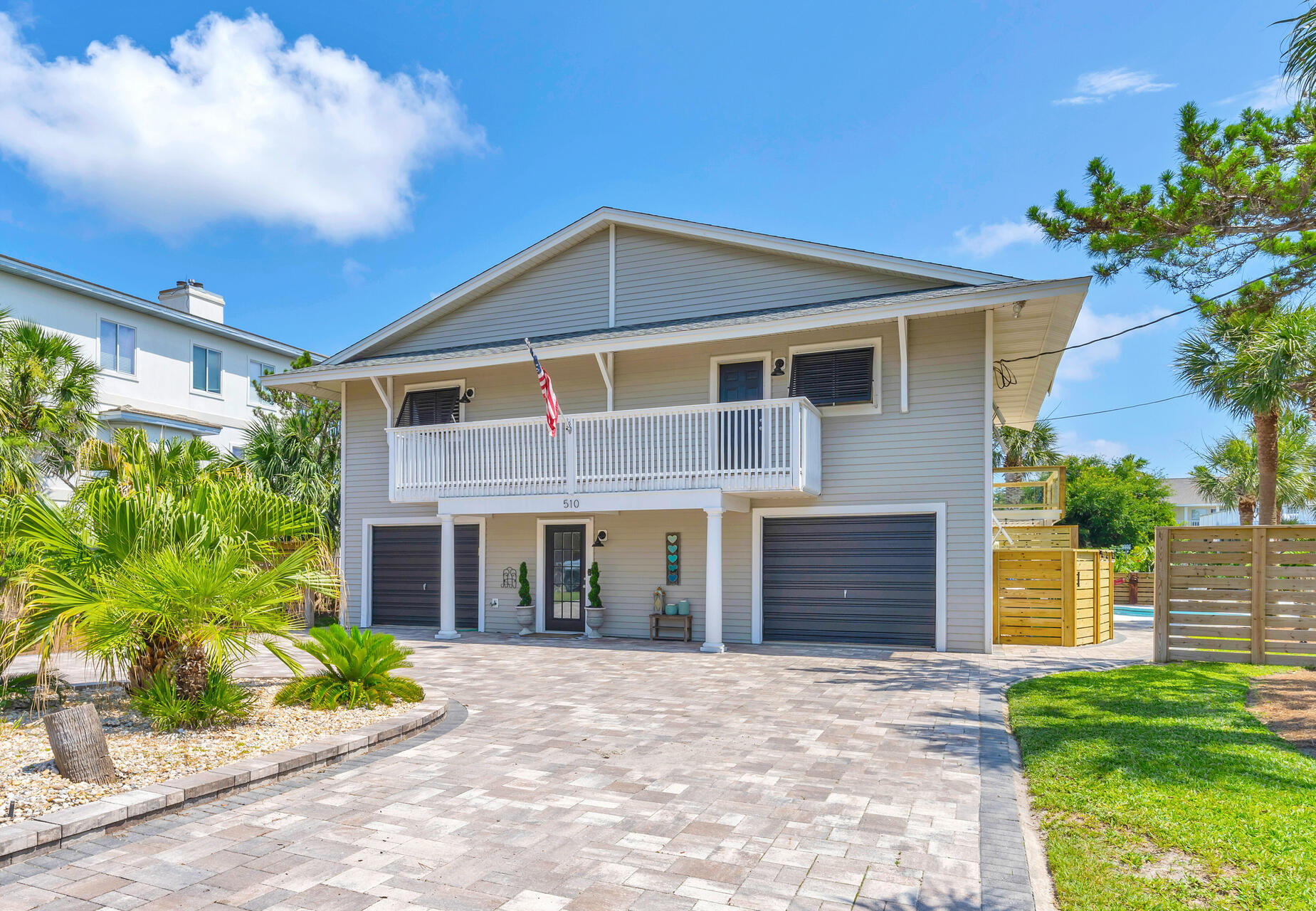 Recently Updated home on Holiday Isle! Best of both worlds, steps from the beach or boat to the Gulf in minutes.This 4 bedroom/ 3.5 bath house features a separate living area on the first level with it's own bedroom, living area and kitchen. The master bedroom is located on 2nd level with a walk in closet and bath has large linen closet. The beautiful kitchen has a large island with granite countertops perfect for entertaining and lots of cabinet space, including in the island. The living room has a new custom built fireplace. This house also has a private pool, 2 boat slips with lifts, wave runner lift  and a 48 ft.seawall. Outdoor living space has large covered porches upstairs and downstairs. Many exterior improvements to include all new decking and fencing, exterior lights. The home has many new updates to include new hot water heater, new paint throughout.