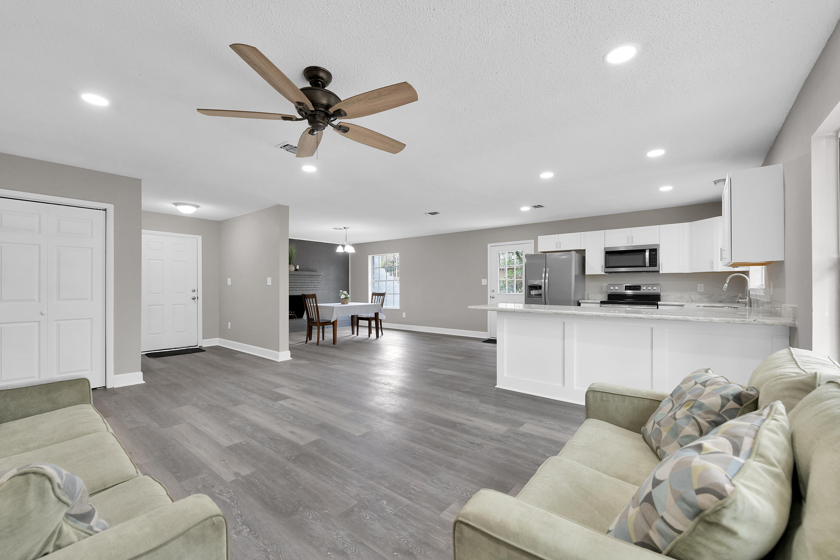 Renovated 3 Bed 2 Bath Brick Home in Fort Walton Beach! The kitchen features NEW White Shaker Cabinets, gorgeous Granite Counter-tops, and Stainless Steel Appliances. The Luxury Vinyl Plank Flooring in living and wet areas ensures low maintenance. The open floor plan's focal point is the beautiful fireplace. New Bathroom Vanities, toilets, and Fixtures. This home is Move In Ready. Copper Wiring, Dimensional shingle roof, fresh paint, new carpet and much more! Two car Garage. Schedule your tour today!
