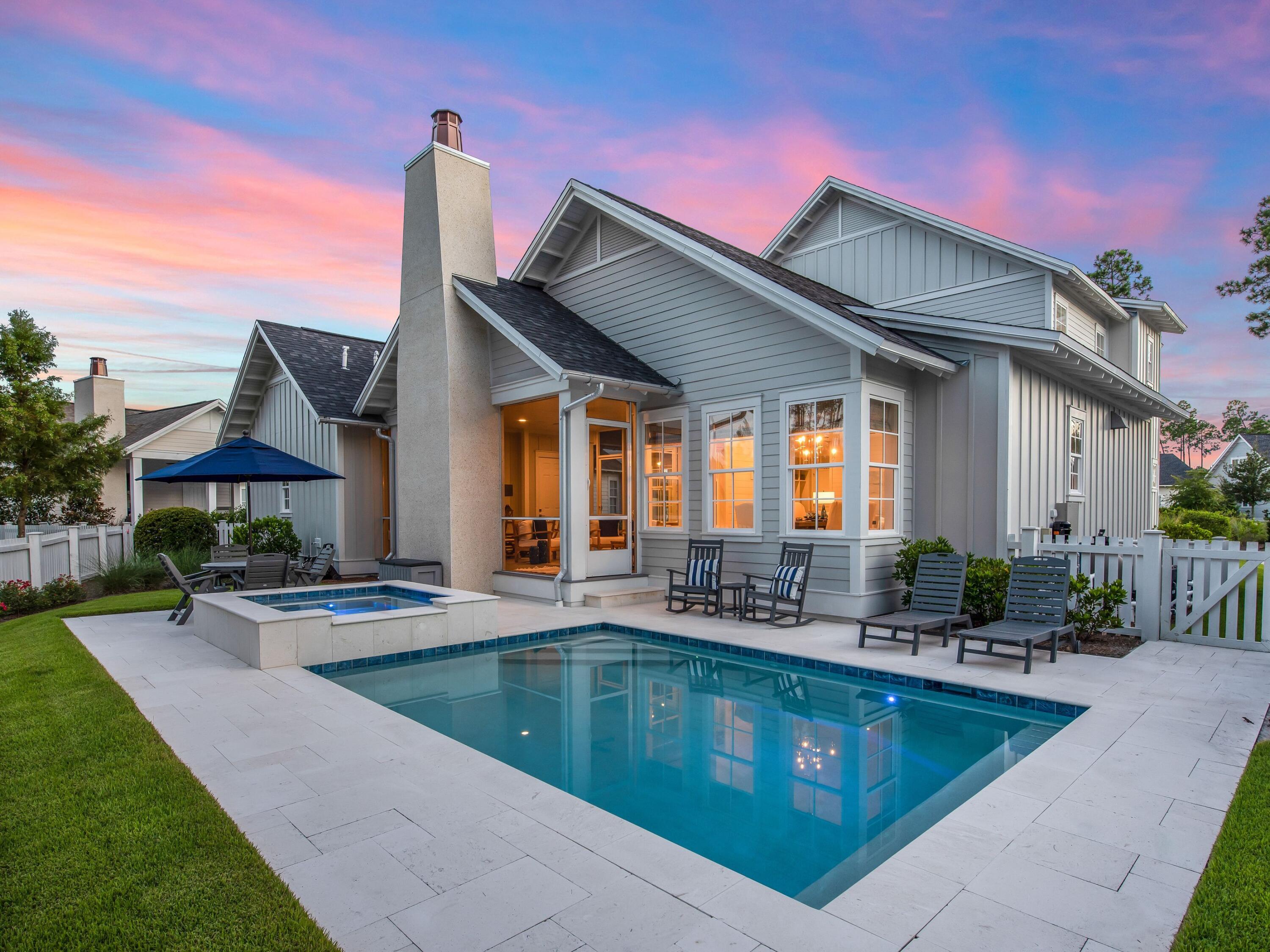 Outfitted with the finest custom fixtures and finishes, this four-bed, four-and-a-half-bath home with pool in Pathways at Watersound Origins sits on one of the most sought-after streets in the community. Completed in 2020, this over-3,000-sq.-ft. home delights with 10-ft. ceilings and hardwood floors throughout as well as unique selections like multiple accents walls and custom window treatments. The spacious open floor plan is replete with natural light and offers an oversized great room and first-floor owner's suite. Its en suite bath has quartz countertops and a marble shower. Home cooks will love the gourmet kitchen with custom cabinetry, oversized island, 36-in. Thermador dual-fuel range with griddle, Bosch refrigerator, Sharp drawer-style microwave, quartz countertops and pantry. Upstairs, you'll find three additional beds and baths as well as an oversized loft area that could serve as an office, media room or play area. The yard offers a relaxing covered screened in porch with a fireplace, professional lighting, and a brand new salt water pool spa, all overlooking a community pond and green space. Watersound Origins boasts unparalleled community amenities such a fitness center, seasonally-heated community pool, nature trails, two private golf courses and dock access at nearby Lake Powell. An optional membership in the St. Joe Beach Club featuring private beach access with beach service, two pools, two restaurants and a bar with gulf views may be available for purchase. This community is just moments from Scenic Highway 30A with its world-class dining, shopping, attractions and events.
