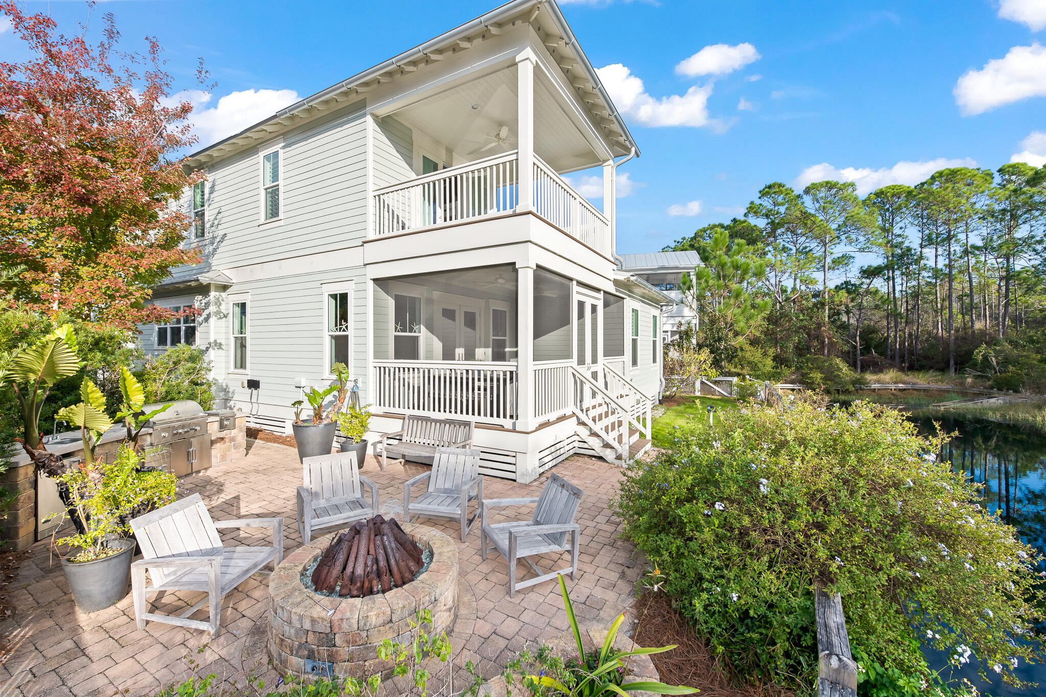 Recent $200k price improvement makes this is a steal as it's the most upgraded of any home in NatureWalk on the market! It's the best price per/sqft for home with a backyard & priced to sell!  Welcome to NatureWalk at Seagrove, where scenic beauty meets luxury living. Nestled on Salamander Circle, this exquisite home, 28 Salamander, is a true gem. 
As you step through the door, upgraded wood flooring throughout sets the tone of elegance in every room. This home effortlessly radiates sophistication and style, meticulously furnished by Pizitz with acclaimed brands like Verellan, Lee Industries, and Restoration Hardware. You are first greeted with a cozy sitting room and the main hallway leading into the open-concept kitchen and living area. You'll notice the amazing upgrades right away - from the elegant marble countertops and ceiling-high cabinets to the pristine white beams.  The open kitchen is a chef's dream, featuring GE Cafe series appliances, including a double oven and a 48-inch gas cooktop. The white shaker cabinets, glass uppers, marble countertops, and classic white subway tile create a truly stunning space. The spacious 1st-floor primary suite lies just behind the living room.

The primary suite on the first floor overlooks the serene preserve and pond. It has tons of natural lighting and the bright bath features marble countertops, a free standing tub, double sinks & vanity area. The expansive closet is such an added bonus, not many beach homes offer this big of a closet. You're sure to enjoy this area as your main primary retreat! 

As you find yourself upstairs, you'll find 3 more suites, allowing for tons of space for your friends and family to visit! The front secondary suite offers a built-in desk in the closet, a bathroom with double sinks and a large shower, and a huge porch with a bed swingideal for unwinding after a day spent by the beach. The back secondary suite offers two sets of bunks, fun bean bags, and a large back porch perfect for all the kids to have their own space!  An additional bedroom with full bath finishes off the 2nd floor. 

Going back downstairs you have ample space in the first-floor office providing a functional workspace. The laundry room also features a small desk, perfect for organizing the family!
This stunning home is turnkey-ready ensuring a seamless transition for its new owners. 

The backyard enclave is a paradise, offering breathtaking views of the beautiful pond and forest. Witness spectacular sunsets from the comfort of your own outdoor oasis. The custom gas firepit and outdoor kitchen, complete with a Coyote grill, beverage fridge, and gas burner, make entertaining a delight. The house is equipped with exterior gutters, providing practicality and protection. With four spacious porches, both in the front and back, you can immerse yourself in the wonders of nature. 

NatureWalk is a highly sought-after community near Seaside, Watercolor, and the crystal blue waters of the Gulf. With its own special trail through the forest, reaching the famous 30A beaches is a breeze. Nestled amidst the forest, NatureWalk offers a serene retreat away from the bustling crowds. The community amenity center, The Gathering Place, is just steps away from this home. It offers a range of activities, including two pools (one heated lap pool), a hot tub, a kiddie pool, a fire pit, grills, a bar area, and a sports court with pickleball nets. Miles of trails, fitness stations, and access to trails in Point Washington provide ample opportunities for outdoor recreation.