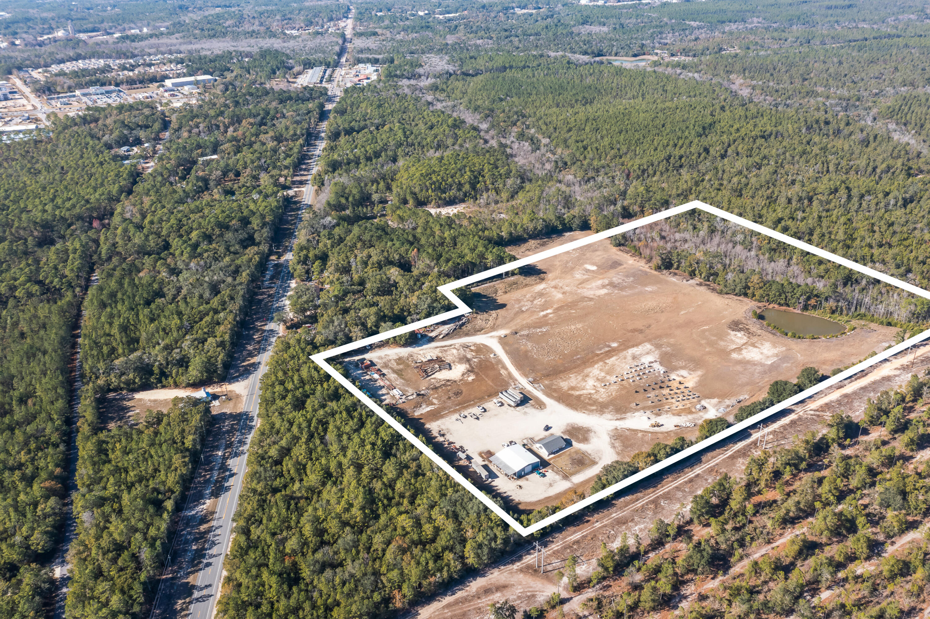 Prime 25.84± Acre Mixed-Use Opportunity in Growing Freeport, Florida

Positioned in the rapidly developing community of Eastern Freeport, this expansive 25.84± acre parcel offers exceptional flexibility for investors, builders, and end-users. Located just off Highway 20 East—with access via a 55± foot ingress/egress easement—this property combines strategic location, valuable zoning diversity, and existing improvements to support a wide range of future uses.

Approximately 75% of the land features average elevation and has been partially excavated for fill dirt, offering a head start for construction or site development. The northern 25% includes a natural low/pond area, adding potential for creative site planning or environmental integration. Public utilities are available to or near the property.

Zoning classifications include I-1 (Light Industrial), R-2 (Medium Density Residential), and SDD (Special Development District), providing rare versatility for industrial, residential, or mixed-use development.

Built in 2021 and in good condition, existing improvements include:

1,280± sq. ft. office building

3,000± sq. ft. warehouse with attached shed

Dirt drive access

Underground electrical service

Private well and septic system

Whether you're seeking a light industrial site with existing infrastructure, a residential development opportunity, or a mixed-use project in a thriving Walton County market, this property delivers unmatched potential.