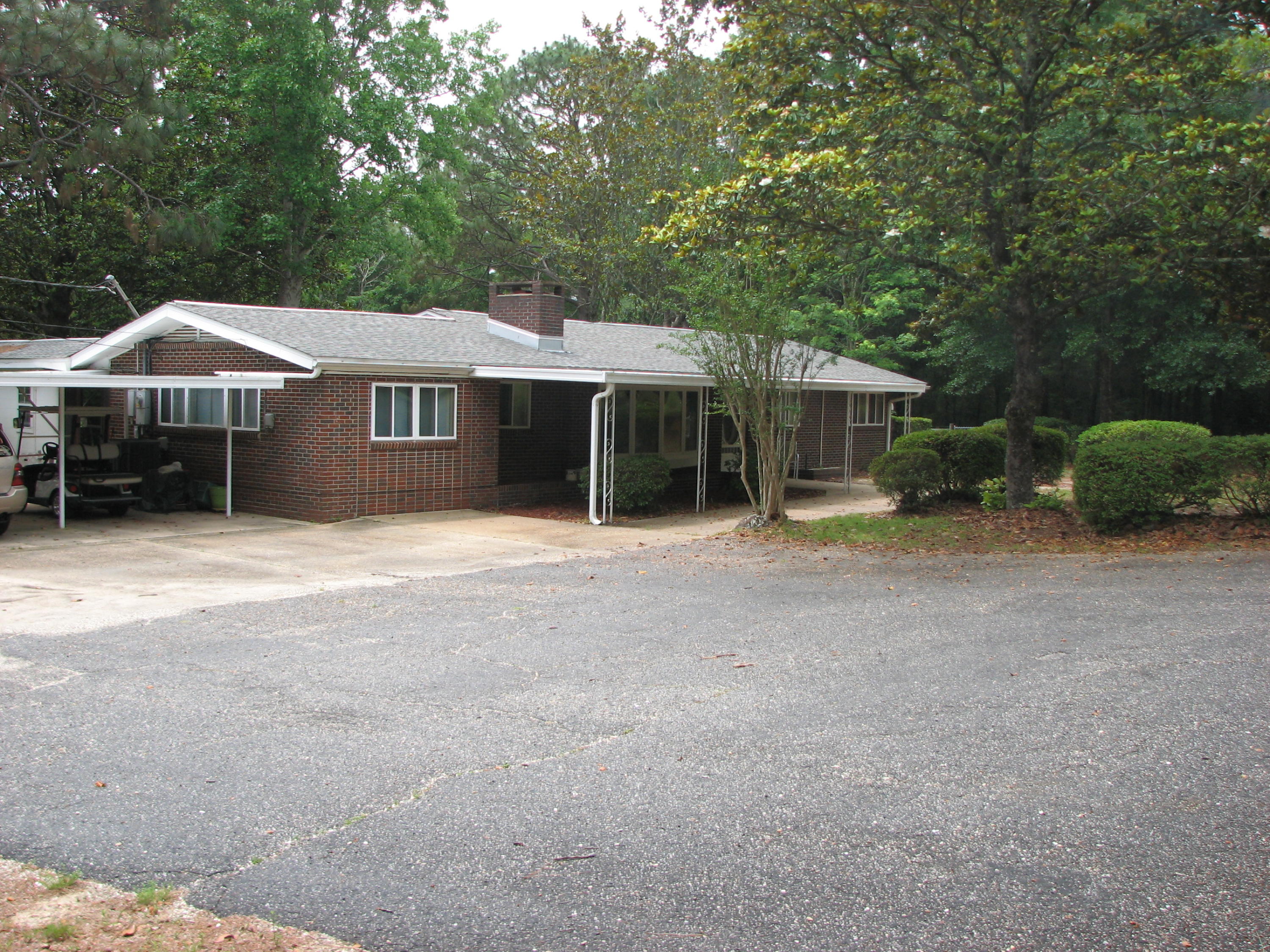 CONVENIENCE AND PRIVACY LOCATED ON THIS 3.99 ACRE SETTING WITH YOUR OWN PRIVATE DOCK FOR FISHING, IN-GROUND POOL AND 2 WORKSHOPS FOR THE HANDYMAN. THE ENTIRE PROPERTY IS FENCED WITH A ROLLING GATE ON THE SIDE, OPEN AND COVERED DECKS ON THE REAR FOR RELAXING AND ENTERTAINING, CARPORT WILL FIT 2 OR 3 CARS. OLDER HOME HAS CHARACTER AND CHARM THRU-OUT WITH WOOD BURNING INSERT IN FIREPLACE, BRICK FLOOR IN SUN ROOM AND BREEZEWAY, OWNER IS LEAVING EXTRA REFRIGERATOR, FREEZER PLUS WASHER AND DRYER. THE SUN ROOM, ADDITIONAL BATHROOM AND LAUNDRY ROOM ARE NOT INCLUDED IN SQ.FT AS THEY ARE NOT HEATED OR COOLED(APPROXIMATELY 558 SQ FT)