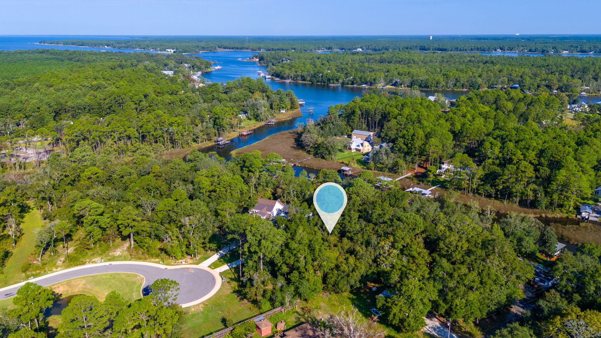 1/2 Acre Waterfront lot with New dockage. Build to suit in the newest Gated Community in Freeport . Experience the unique waterfront lifestyle with direct boating access from your backyard to the bay. Live amongst the natural beauty of the coastal environment and build your private retreat. Lot size is .48 acres. Redfish Point is minutes from the white sand beaches, restaurants shops and parks of South Walton County.