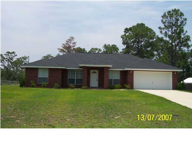 Split floorplan, corner tile fireplace in great room, vaulted ceiling, kitchen with bar and eating area, formal dining room, master suite w/trey ceiling, large walk in closet, separate shower and garden tub and more....