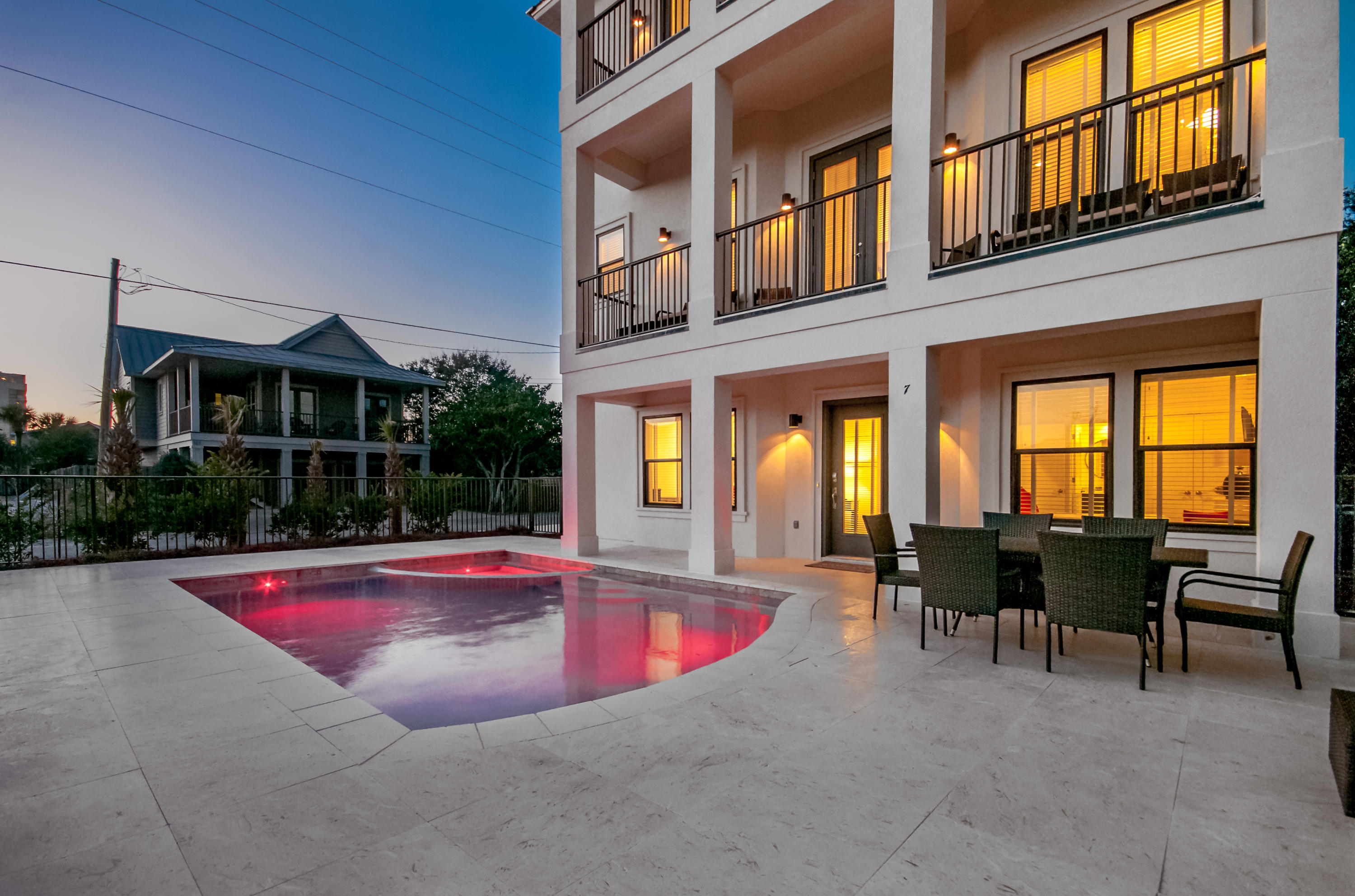 New Construction, Private, Resort-Style Pool and Gulf Views in this well-appointed 6-bedroom vacation rental in a quiet beachfront community in Miramar Beach. Projected to top $172K in its first full year on the rental market, ''Sandy Dunes'' is the perfect vacation rental. This home is conveniently located just steps from the community beach access and within a mile of Silver Sands Outlet Mall and Baytowne Wharf's entertainment district. A sleek white stucco exterior leads to neutral gray interiors and tropical accents. Days lead from beachside to poolside. Nights call for grill-side gatherings and a relaxing spa soak. Gulf views command sunrise and sunset salutes. Step inside to the first floor of the home and you'll find three bedrooms, two king suites, and a double queen suite, each with a private bathroom. Take the elevator to the second floor of the home to the main living space. This space is delicate and open with top-of-the-line fixtures, stainless steel appliances, and a balcony with corridor Gulf views. The hardwood floors and accent wall pull the room together for the ultimate luxurious feel. The whole family can gather in this area for time well spent and create memories to last a lifetime. A king suite is also located on this floor and has a private bathroom. The third floor houses the master suite with a king bed and private balcony access with views of the Gulf. The private bathroom is spacious and spa-like with a tub, standalone shower, and dual-sink vanity. The walk-in closet is also very large and provides shelving for organization. The bunk room is also on this floor and has a full-over-full bunk bed, balcony access and a private bathroom.