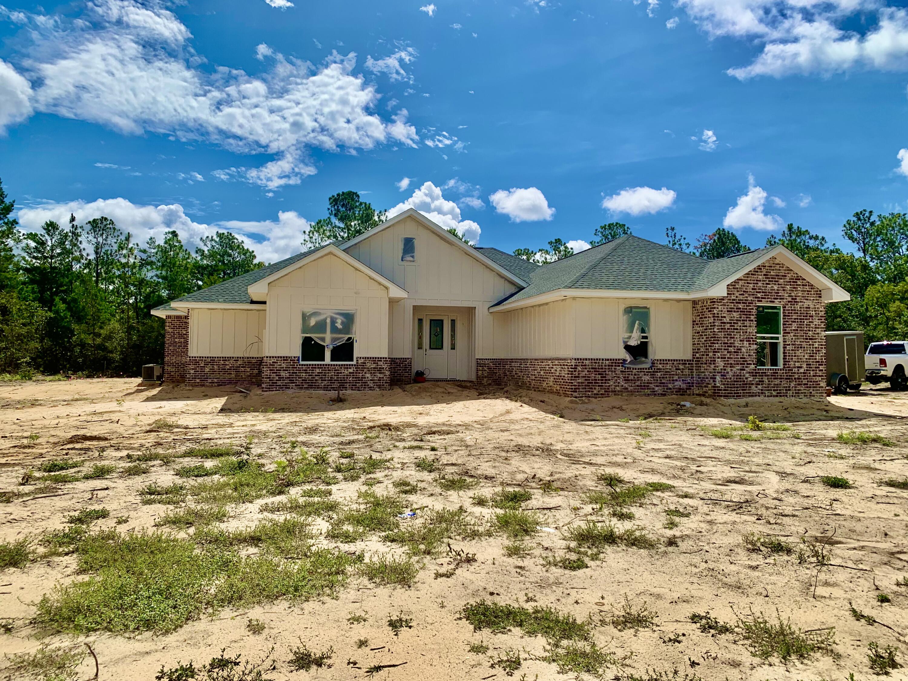 New Construction scheduled to be completed at the end of August 2022.  Don't miss out on this beautiful custom built home with 4 bedrooms, 2 full baths and sits on 1 acre.  Where else are you going to find this in Crestview?  Did I mention NO HOA.  This home has been well thought out and the builder did not skip on the upgrades.  Here are just a few features but you'll need to view this home to see all that it has to offer. Let's start with 10' ceilings, all the windows are trimmed out, crown molding throughout the main living area and master bedroom, additional access to the laundry room off the master closet, soft close custom cabinets throughout, built in bench inside the hall area from the garage,LED lighting throughout, upgraded farmhouse light fixtures, garage comes equipped.. with electric car charger, generator disconnect, large back porch, irrigation system and plenty of room to add a pool, workshop, or to park your RV or boat.  This home has it all, it's just waiting for you. (More photos to be added)