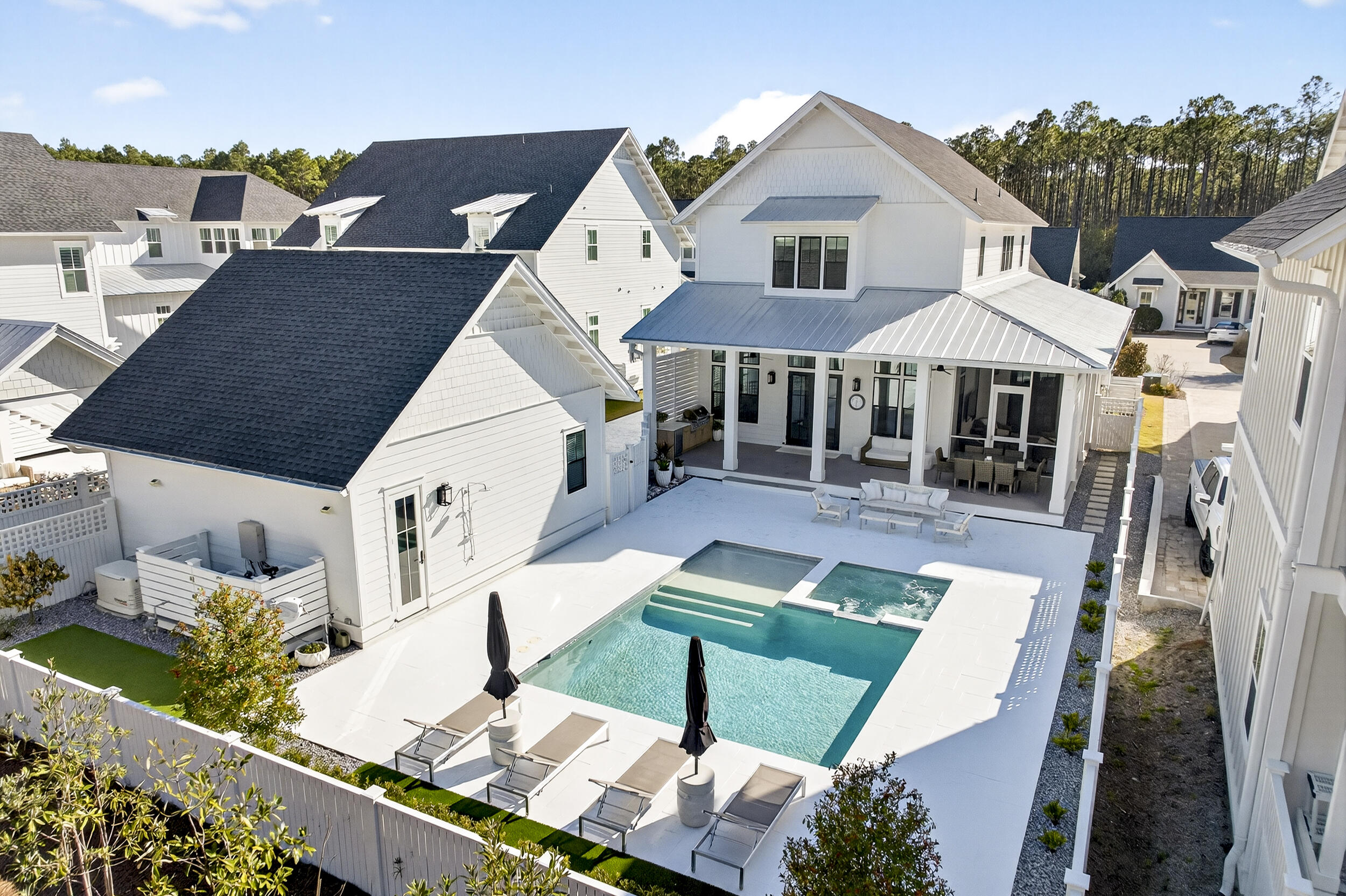 Serenity now awaits in this beautifully appointed Sandcastle plan located in Greenway/Phase 3 of Watersound Origins. Designed for effortless living and refined coastal style, this 4-bedroom, 4.5-bath residence blends thoughtful functionality with high-end finishes throughout.
The main level features a private primary retreat complete with an oversized walk-in closet, creating a peaceful sanctuary tucked away from the home's additional three en-suite bedrooms upstairs. Guests are welcomed through an inviting entry foyer with a convenient powder room. The light-filled central salon flows seamlessly into the island kitchen, where a breakfast bar, walk-in pantry, and Monogram stainless steel appliancesincluding a gas range with hoodmake entertaining a pleasure. A well-designed mudroom offers stackable laundry, custom cabinetry with sink, and a side entry to the drivewayperfect for unloading groceries or beach gear with ease.

Luxury details set this home apart, including wood flooring throughout, 12-foot ceilings on the first floor, shiplap accents in all common areas, 8-foot solid core doors, custom built-in closets, and a curated designer lighting package. 

Outdoor living is equally impressive. The expansive rear green space showcases fresh landscaping surrounding an oversized 26x18 private pool with a 9x9 spa and 9x9 splash deck. A custom NatureKast Summer kitchen, screened-in side porch, and open-air porch create the ultimate setting for relaxing or entertaining year-round. Completing the property is a 2-car detached garage.

As a resident of Watersound Origins, enjoy unparalleled amenities including complimentary golf at Origins Golf Club, a resort-style pool, fitness center, tennis, pickleball, basketball courts, parks, walking trails, and kayaking from the Lake Powell dock. The vibrant Origins Town Centerfeaturing Publix, Starbucks, dining, and boutique shoppingis just moments away. With a 6-month minimum lease policy, this 1,400-acre community welcomes both full-time residents and second homeowners seeking a coastal retreat near the white-sand beaches of 30A.
A must-see and a must-have, this exceptional home offers the perfect blend of luxury, lifestyle, and location.