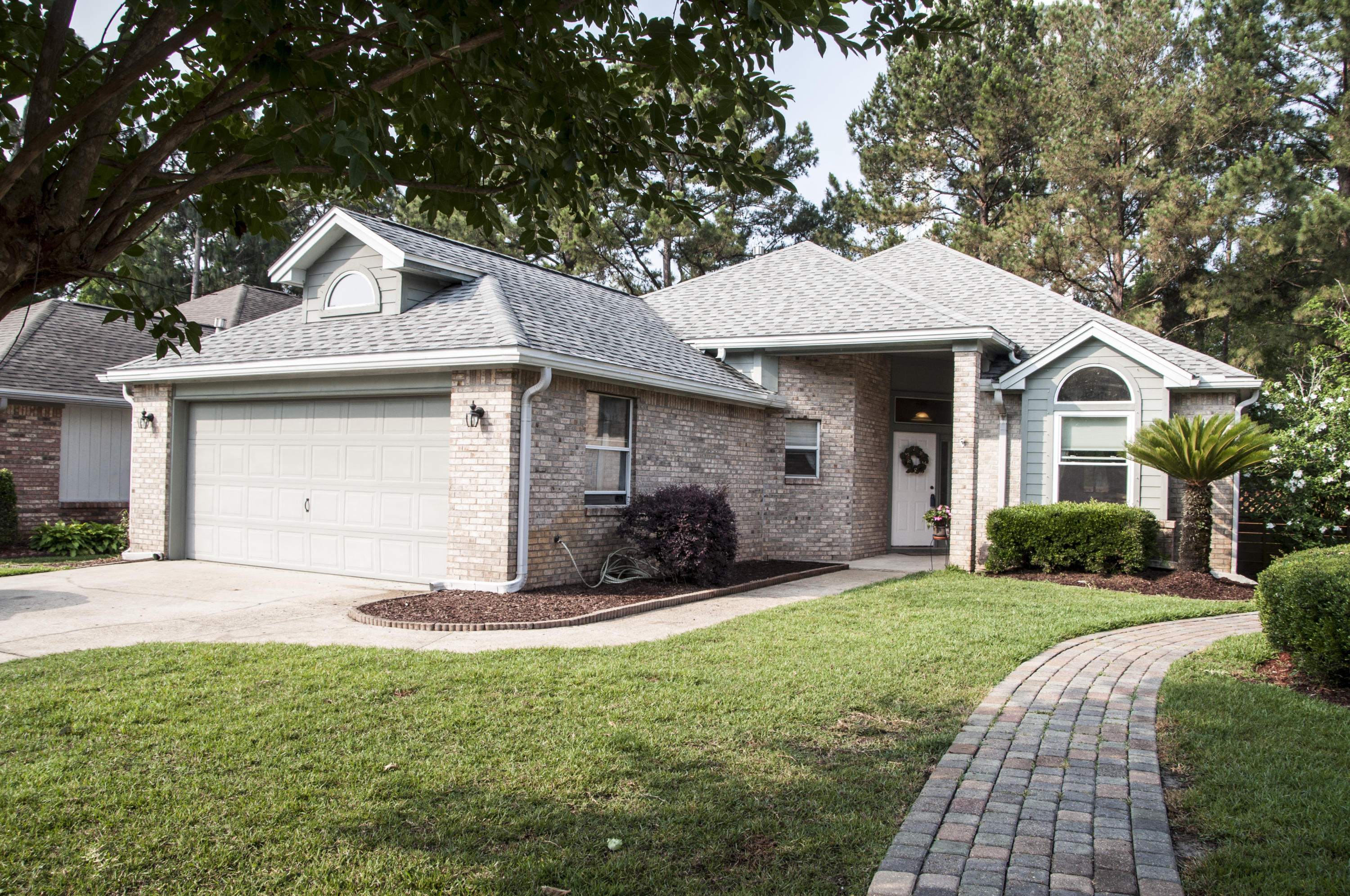 Leave the hustle & bustle of Fort Walton Beach behind as you drive through beautiful Crosswinds Landing to your new home! Located on a quiet cul-de-sac this spacious, open floorplan features soaring ceilings and a freshly painted interior. Enjoy afternoons & evenings in the privacy of your backyard from the covered patio as you listen to the frogs in the wooded lot beyond the fence and awake to relaxing sounds of the birds singing. Kitchen & Greatroom are perfect for entertaining and the gas fireplace provides ambiance on cooler evenings. Highlights of the remodeled master bathroom include a tile shower, dual shower heads, whirlpool tub & double vanity. Custom shelving in closets & garage. Roof replaced in 9/2013; exterior to be painted 5/2018. Well water source for lawn pump & sprinklers--no county water expense! Complete with hurricane coverings for windows & doors.  Conveniently located between Eglin AFB and Hurlburt Field.  Close to shopping and hospitals.