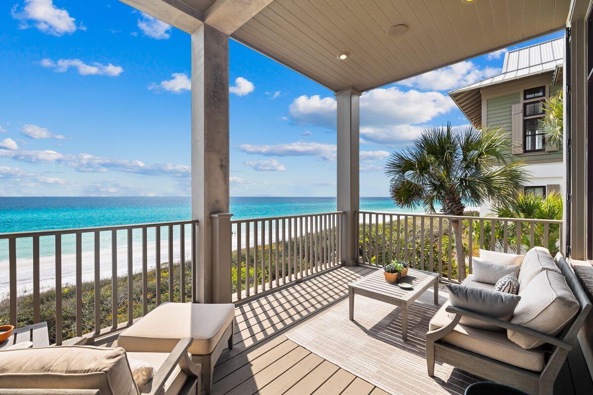 Elegantly presiding upon the manicured dunes in the exclusive community of The Retreat, this worldly-inspired compound property provides a reprieve from the expected. Upon entry into the community through the meandering tree-lined drive, property intenders will be warmly welcomed by mature vegetation and spacious homesites, accented by the redesigned Beach Club — an amenity second to none on the west end of 30A. A case study of both enchantment and architectural detailing craft a unique experience at 131 West St. Lucia Lane, imagined by the late architect Dawn Thurber and brought to life by the meticulous craftsman at Davis Dunn Construction. The courtyard entryway to the three-level home provides a strong sense of arrival, while manicured foliage and plentiful outdoor spaces on the main level provide mesmerizing views of the glittering gulf waters from each level of the property. This fully concrete construction home elicits a powerful aura of quality, while details such as a summer kitchen, fire pit, and heated gulf-front outdoor pool ensure that time spent within the property's footprint is as special as possible. 

A main level gulf-facing bedroom with direct patio access and a hallway-accessible full bath anchors the first of three levels in this home, while access to the two-car garage with a three-stop elevator and a flex room directly off the covered patio finishes off this level. Herringbone brick flooring and mitered edge shiplap walls provide a delightful blend of heritage and contemporary styling upon entry into the property. 

The second level of the home provides a masterful living experience courtesy of articulated living, formal dining and an expansive chef's kitchen space, fully outfitted with Wolf and Sub-Zero appliances; further accented by reclaimed maple flooring. The living area offers two seating areas, one anchored by a brick facade fireplace, while the larger of the two areas gifts covered deck access with endless views to the south and west of the home. A corner office/flex room on the second level provides direct gulf views through oversized windows, while a northern view guest room featuring a full en suite and a hall half-bath finish out this level. 

On the third floor of the home, the master suite provides artful solace to all who call this home their own. Endless southern vistas of the aquamarine waters of the Gulf of Mexico ensure a perfect wake-up call each morning while an expansive marble-clad master bath embodies ultra-luxe living. Two additional guest bedrooms on the third level, each with private en suites ensure convenience and accommodation, while the western guest room crafts two distinct view corridors over both the Gulf of Mexico and mesmerizing Draper Lake.