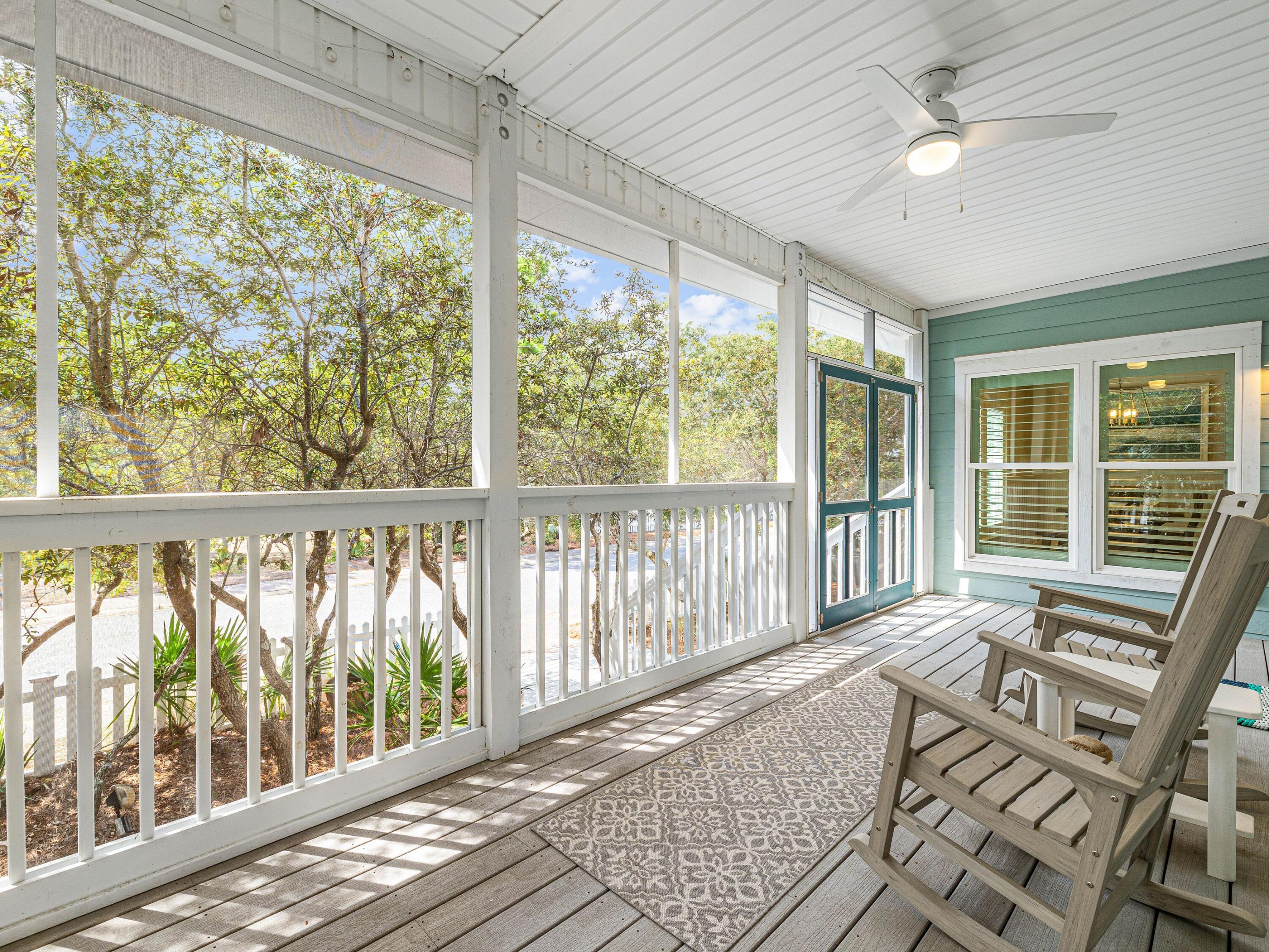 Situated in the gated beach community of Old Florida Beach, this attractive two-story Florida cottage was completely remodeled and updated in 2017. The beautiful carriage house above the two-car garage was added in 2018 followed by a new pool and fire-pit for socializing on the paved patio.  Recent additions include a new roof in 2022. This well-dressed residence is just three lots from access to the community's private beautiful beach.  Step inside from your screened in front porch to find this spacious home with hardwood floors throughout the living areas.  You will have everything you need on the first floor including a laundry room and master suite with under-floor heating in the master bath and a large walk-in closet. Plantation shutters filter sunlight into the bright and spacious living room. Cooks will appreciate the gourmet kitchen, which has a large island with farmhouse sink, gas cooktop and a full range of recently replaced appliances. A wine fridge keeps drinks perfectly chilled and ready to pour when entertaining on the open dining area or screened porch. Stairs lead up to the second floor where you'll find a bunk bedroom, full bathroom and a spacious guest suite with a private bath and an abundance of storage and beautiful views. The large wraparound porch on this upper level provides ample outdoor living space for catching the breeze on the generous deck. The attractive one-bed carriage house is perfect for independent family members, or for additional rental income. Fully self-sufficient, it has a full kitchen, sitting area, bathroom and washer/dryer as well as a balcony with views of the Gulf of Mexico. Screened by mature trees and private greenery, this home enjoys its own privacy and seclusion yet is conveniently close to amenities. Make use of three beach walkovers, a heated community pool and a private dock for kayaking, fishing and paddleboarding on neighboring Draper Lake.