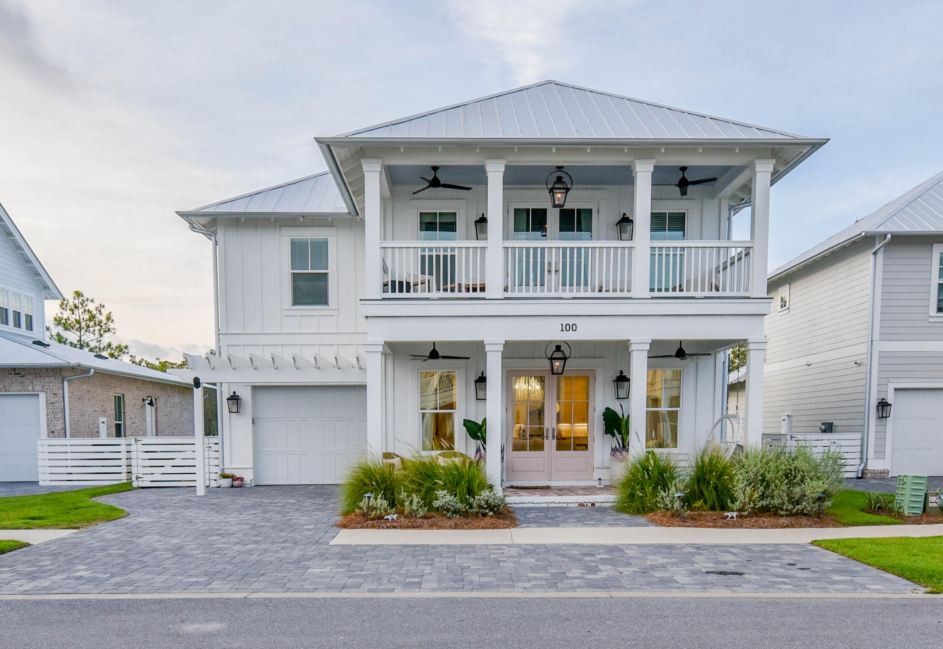 Welcome Home! 100 White Cottage Rd prestigiously sits in a beautiful, gated, 38-home private community surrounded by nature preserves. South of HWY 98, this exquisitely appointed beach home is a short ride or walk to the crystal blue gulf and white sand beaches. Perfect for relaxing or entertaining with oversized porches; large, fenced backyard; and a generous, open concept, 10' ceiling main living area. Kitchen features all KitchenAid appliances, designer backsplash, quartz counters, an ample amount of storage, and custom lighting. Upstairs you will find 3 spacious bedrooms and baths. Vaulted master suite opens up to a large private balcony. Master bath offers a double vanity, large designer tile walk-in shower, and custom walk-in closet. You will not want to miss this stunning home!